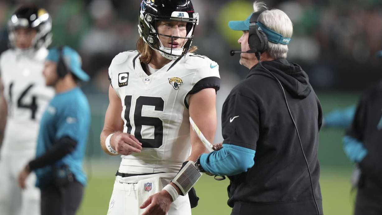 Jacksonville Jaguars quarterback Trevor Lawrence (16) talks to Jaguars head coach Doug Pederson during the second half of an NFL football game against the Philadelphia Eagles on Sunday, Nov. 3, 2024, in Philadelphia.