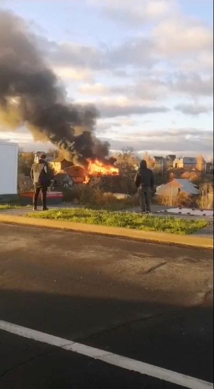 Smoke and fire rise from a residential building following a Ukrainian drone attack, amid the ongoing Russia-Ukraine conflict, in the Ramenskoye district, near Moscow, Russia, Sunday, in this screengrab obtained from a social media video.