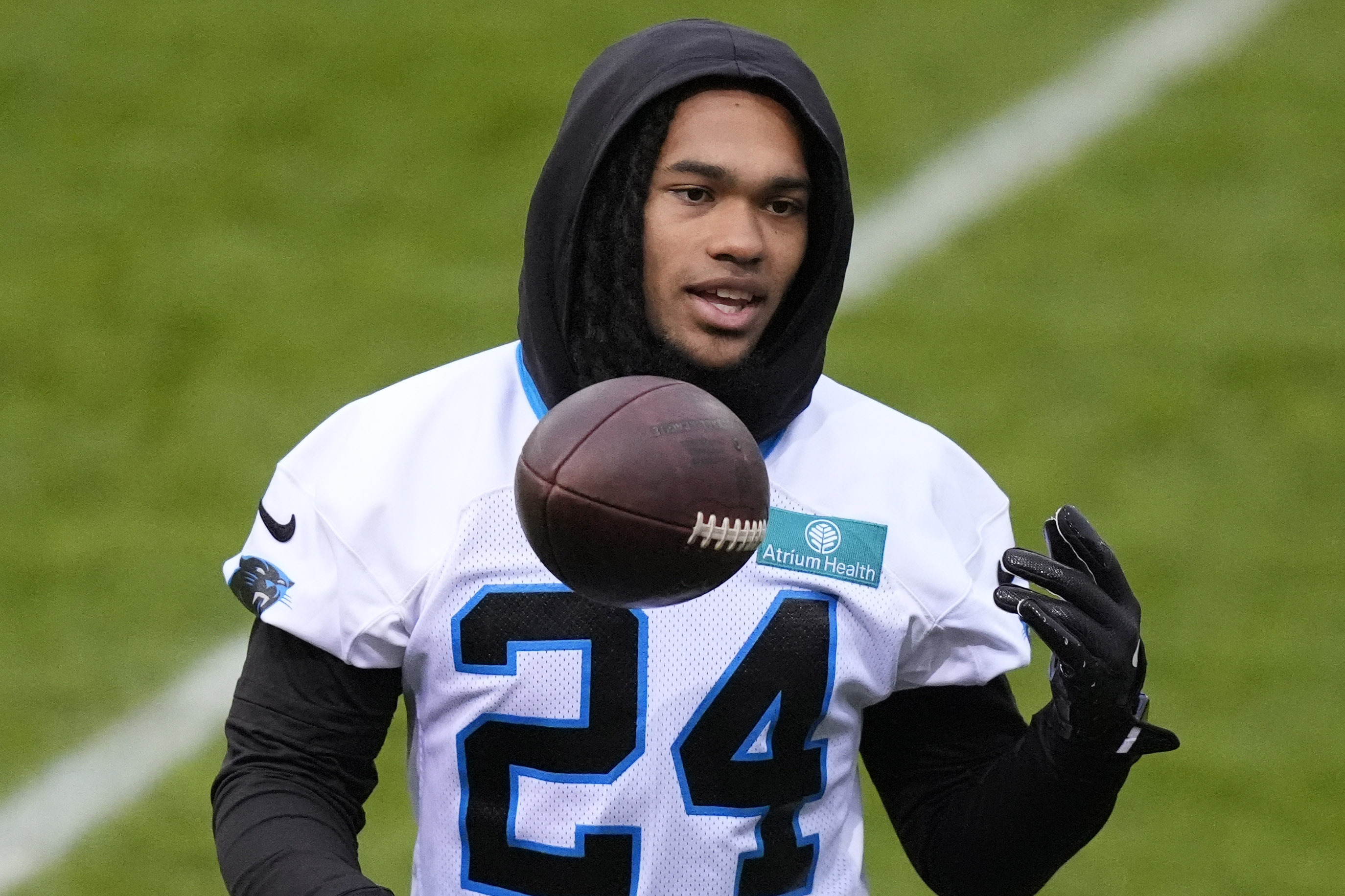 Carolina Panthers running back Jonathon Brooks (24) lifts a ball during a practice session in Munich, Germany, Friday, Nov. 8, 2024. The Carolina Panthers are set to play the New York Giants in an NFL game at the Allianz Arena in Munich on Sunday Nov. 10.