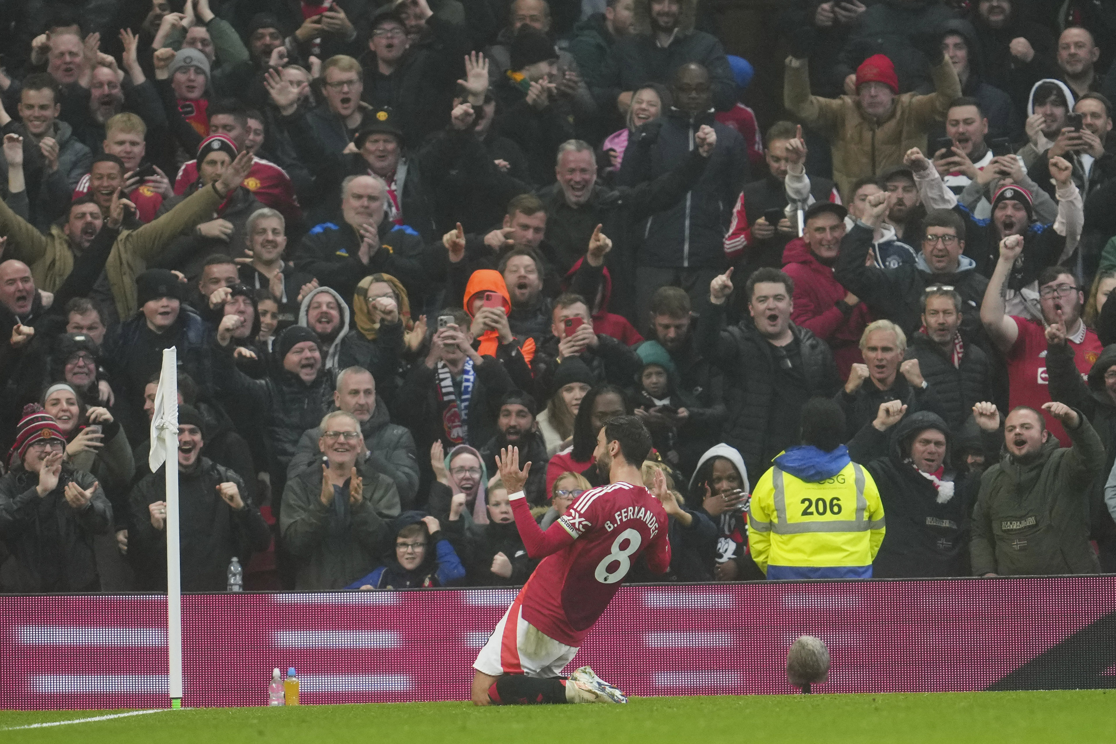 Manchester United's Bruno Fernandes celebrates after scoring his side's first goal during the English Premier League soccer match between Manchester United and Leicester City, at the Old Trafford stadium in Manchester, England, Sunday, Nov.10, 2024.
