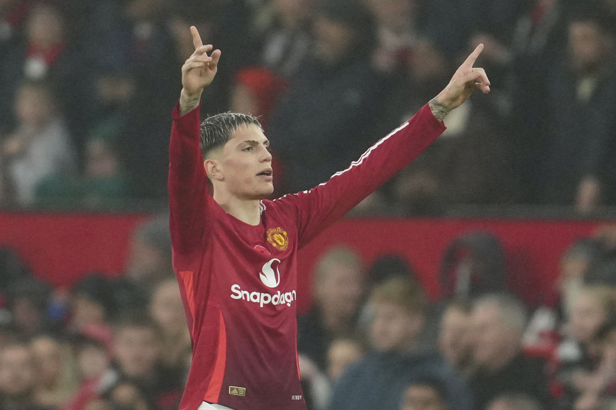 Manchester United's Alejandro Garnacho celebrates after scoring his side's third goal during the English Premier League soccer match between Manchester United and Leicester City, at the Old Trafford stadium in Manchester, England, Sunday, Nov.10, 2024.