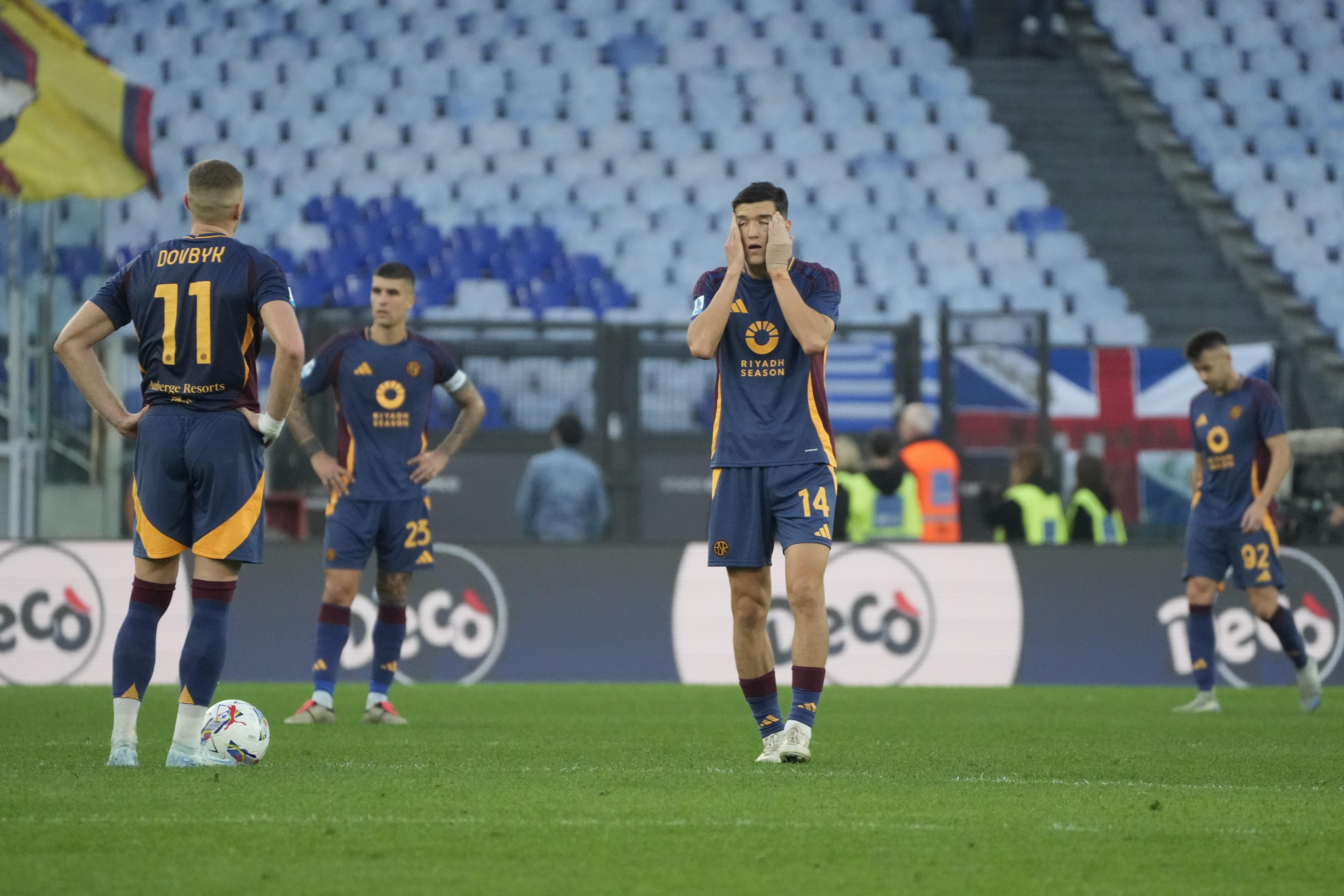 Roma players stand dejected after conceding the thrid goal during the Serie A soccer match between Roma and Bologna at Rome's Olympic Stadium, Sunday, November 10, 2024.