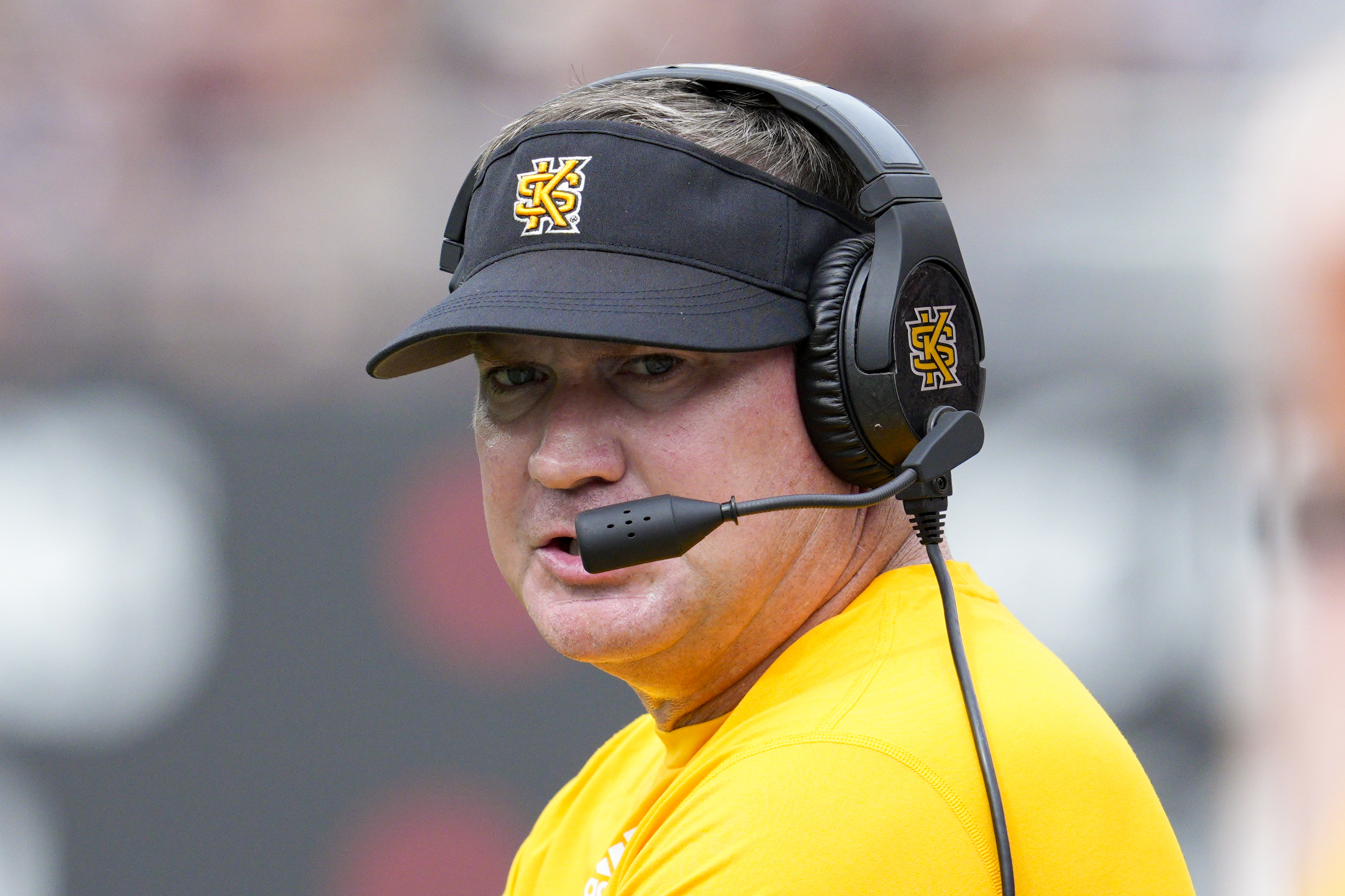 FILE - Kennesaw State head coach Brian Bohannon stands on the sidelines during the first half of an NCAA college football game against Cincinnati, Sept. 10, 2022, in Cincinnati.