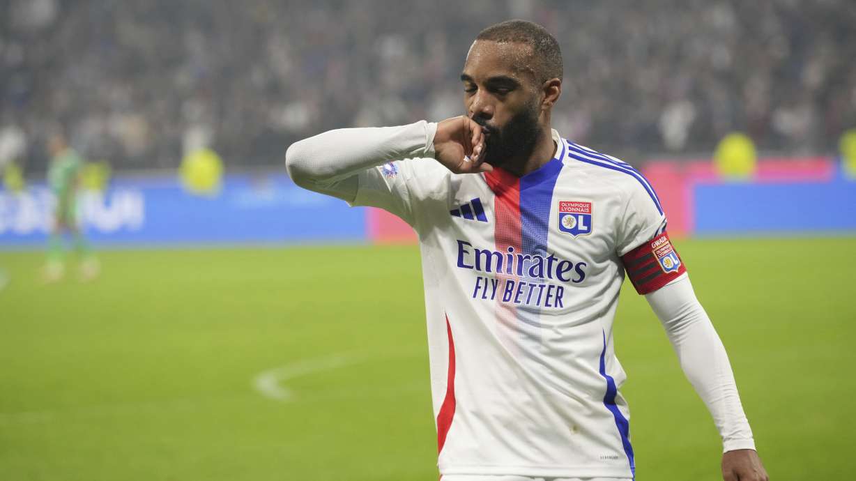 Lyon's Alexandre Lacazette celebrates after scoring a goal during the French League One soccer match between Lyon and Saint-Etienne at the Groupama stadium in Decines, outside Lyon, France, Sunday, Nov. 10, 2024.