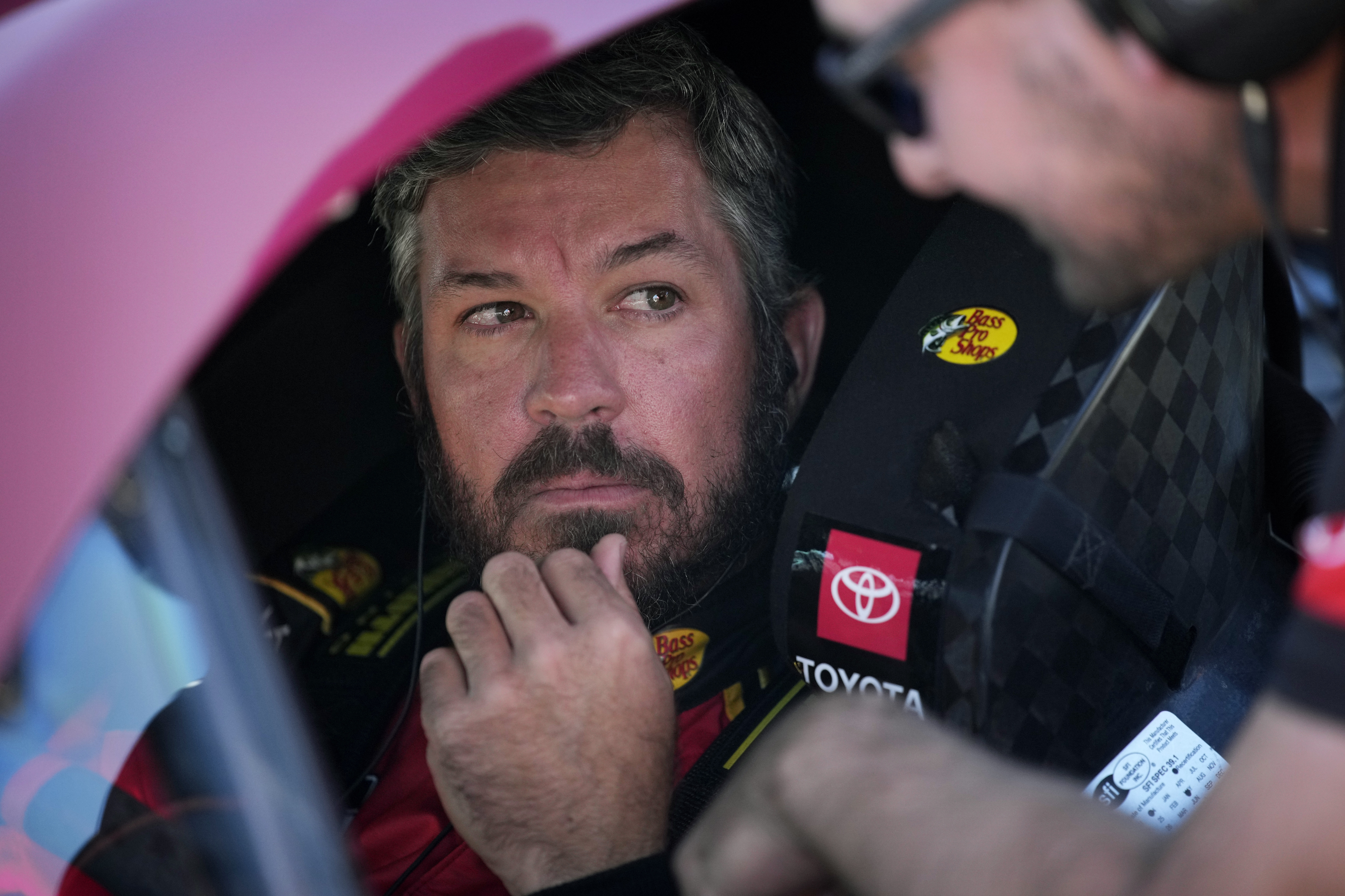 Martin Truex Jr. sits in his car during qualifying for a NASCAR Cup Series Championship auto race, Saturday, Nov. 9, 2024, in Avondale, Ariz.