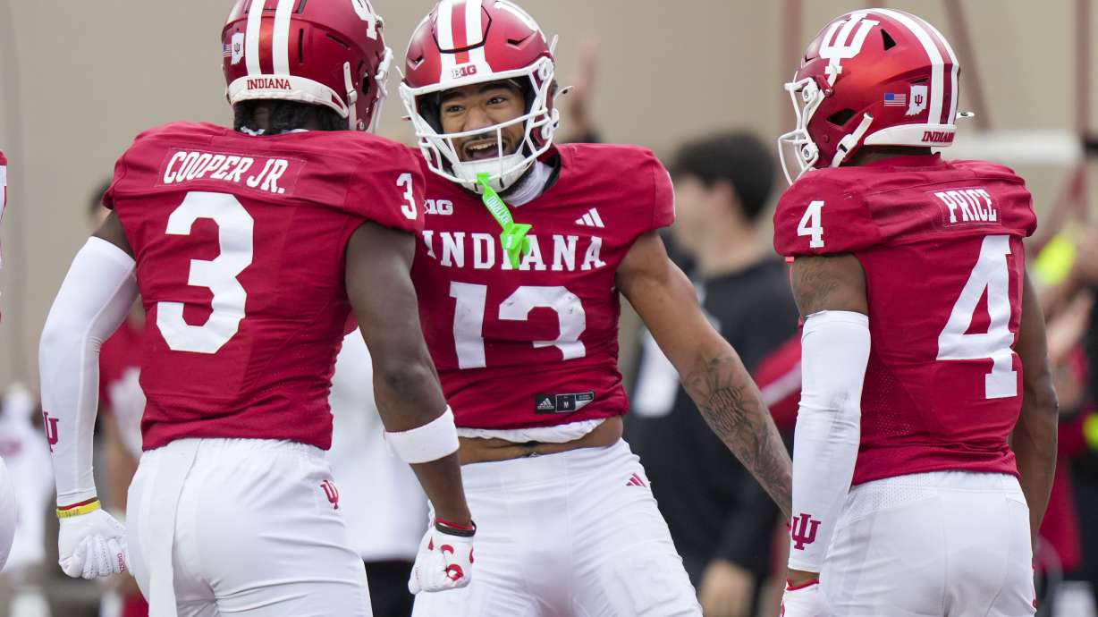 Indiana wide receiver Elijah Sarratt (13) celebrates after a touchdown against Michigan during the first half of an NCAA college football game in Bloomington, Ind., Saturday, Nov. 9, 2024.