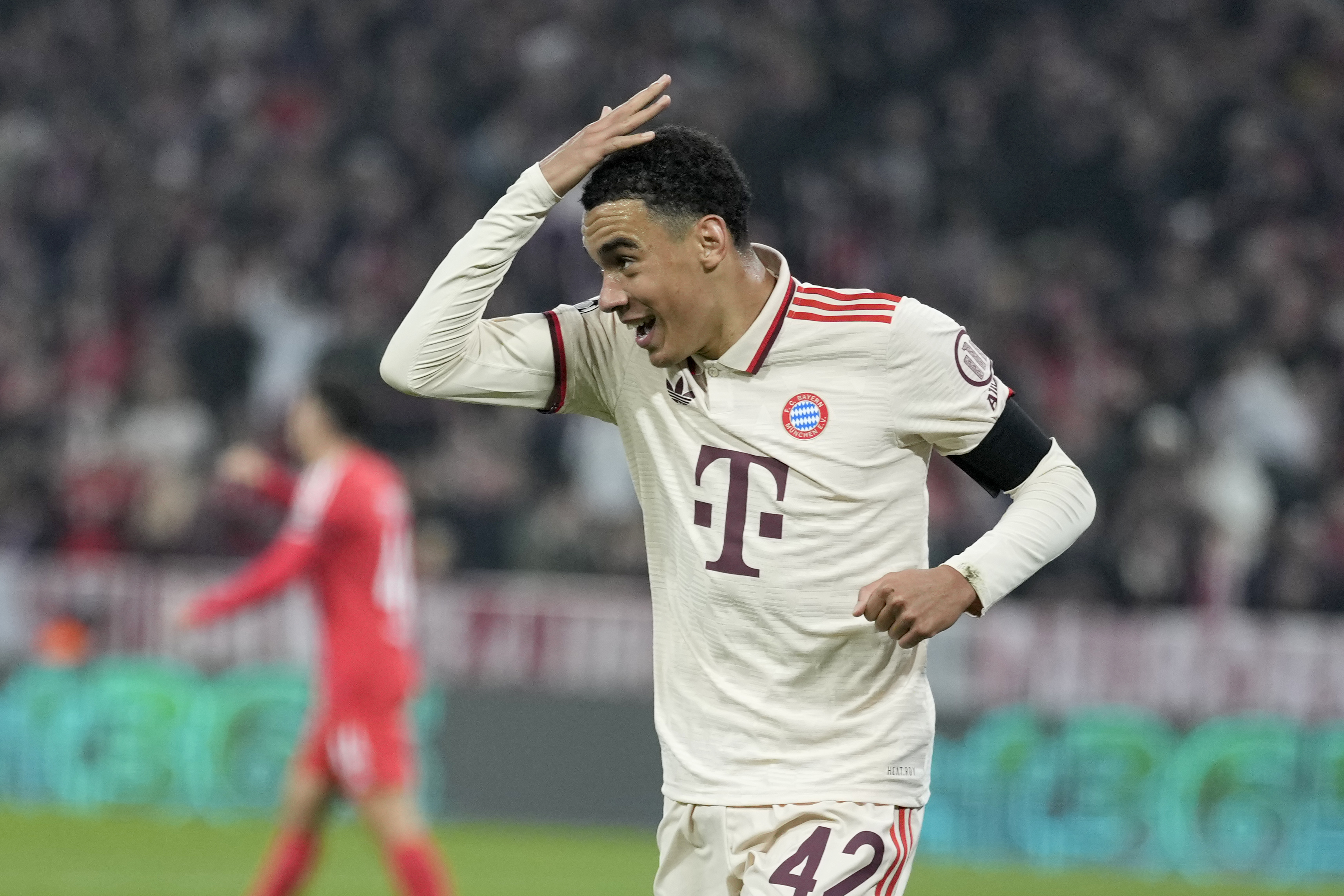 Bayern's Jamal Musiala celebrates after scoring the opening goal during the Champions League opening phase soccer match between Bayern Munich and SL Benfica, in Munich, Germany, Wednesday, Nov. 6, 2024.