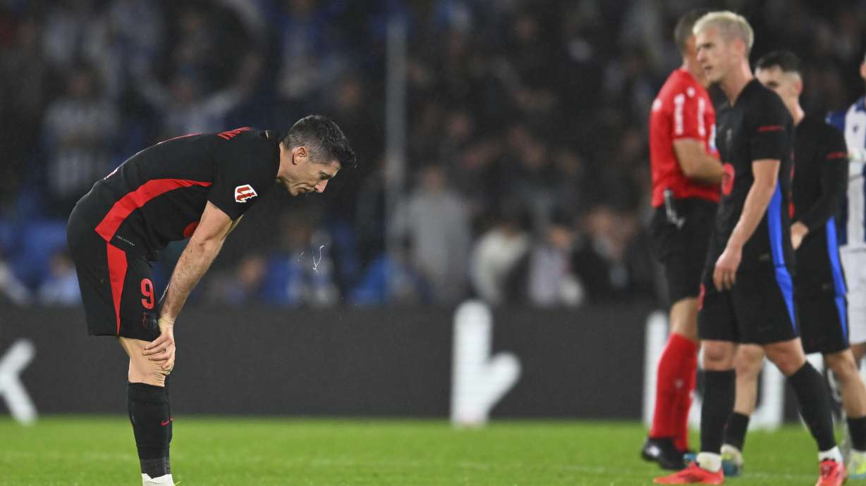 Barcelona's Robert Lewandowski reacts after the Spanish La Liga soccer match between Real Sociedad and Barcelona at the Anoeta stadium, in San Sebastian, Spain, Sunday, Nov. 10, 2024.
