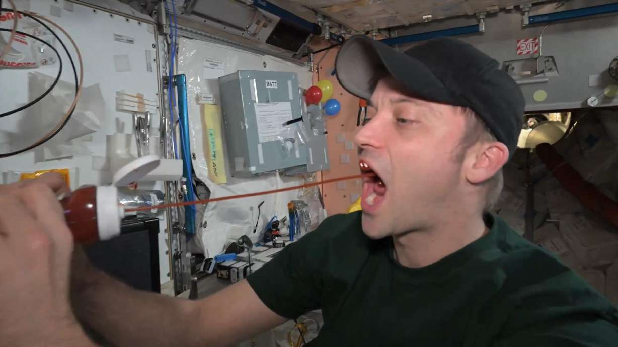 U.S. astronaut Matthew Dominick demonstrates how to eat ketchup in zero gravity from the International Space Station in an Oct. 22 social media post.