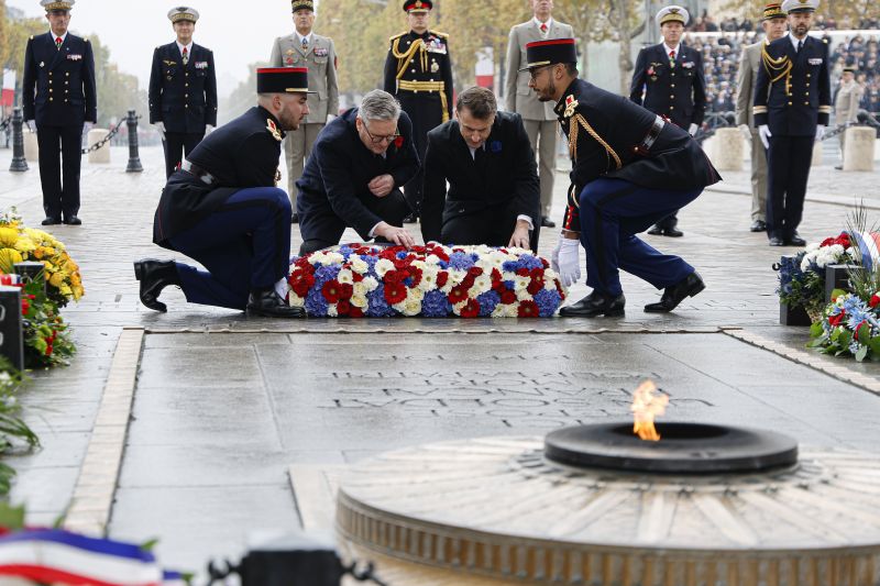 French President Emmanuel Macron, center right, and Britain's Prime Minister Keir Starmer lay a wreath at the Tomb of the Unknown Soldier during commemorations marking the 106th anniversary of the Nov, 11, 1918, Armistice, ending World War I, in Paris, France, Monday.