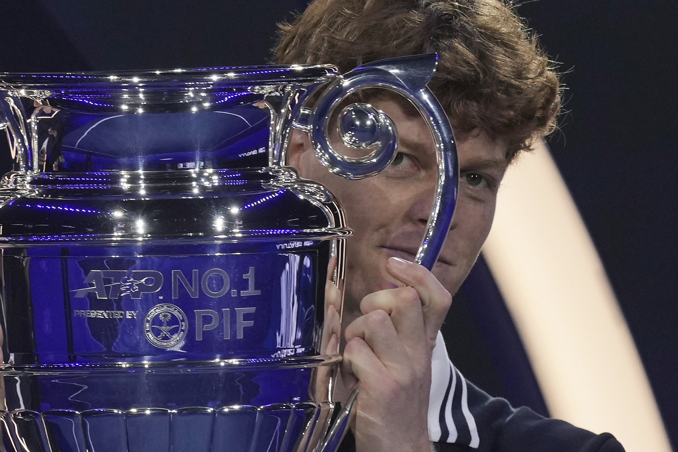 Italy's Jannik Sinner holds the trophy as ATP world best player at the ATP World Tour Finals at the Inalpi Arena, in Turin, Italy, Monday, Nov. 11, 2024. Sinner was presented with the trophy for finishing the year ranked No. 1.