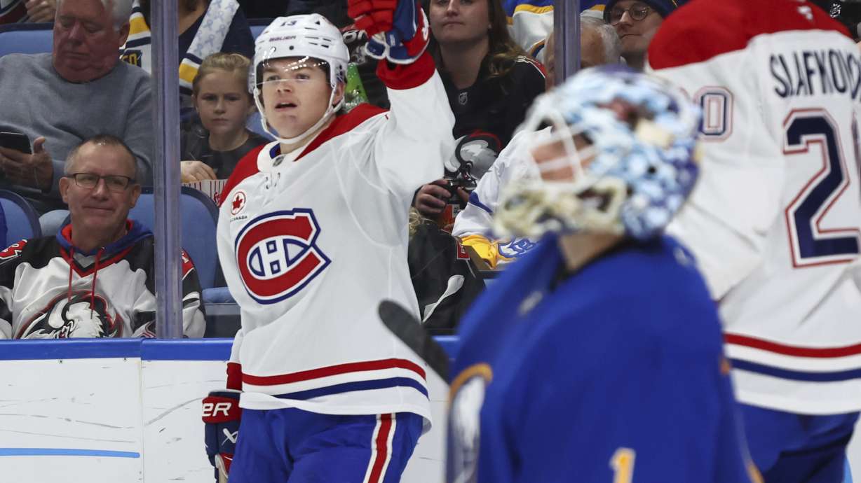 Montreal Canadiens right wing Cole Caufield (13) celebrates his goal during the second period of an NHL hockey game against the Buffalo Sabres Monday, Nov. 11, 2024, in Buffalo, N.Y.