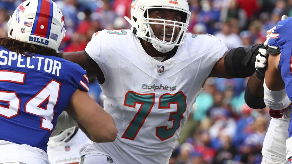 FILE - Miami Dolphins guard Austin Jackson (73) defends the line during the second half of an NFL football game against the Buffalo Bills in Orchard Park, N.Y., Nov. 3, 2024.