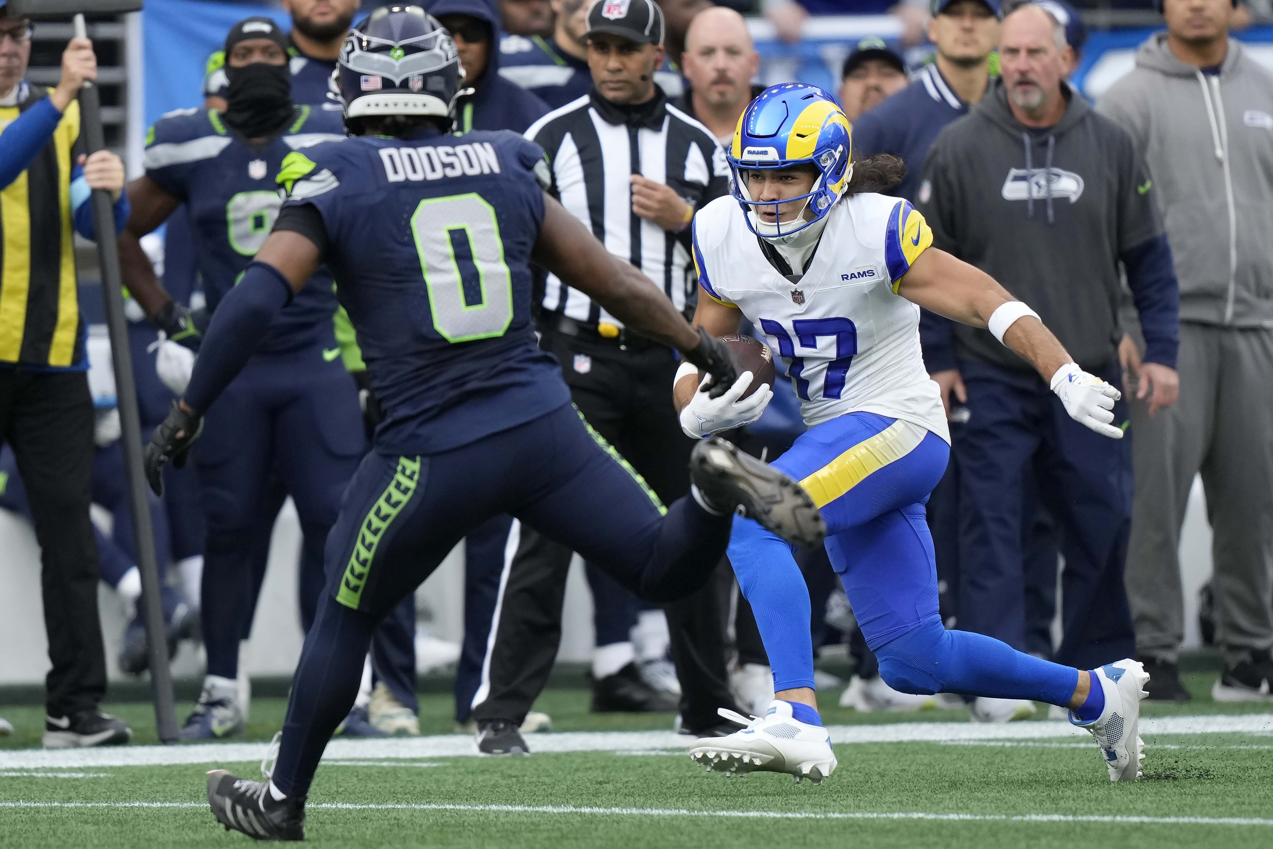 Los Angeles Rams wide receiver Puka Nacua (17) runs against Seattle Seahawks linebacker Tyrel Dodson (0) during the first half of an NFL football game in Seattle, Sunday, Nov. 3, 2024.