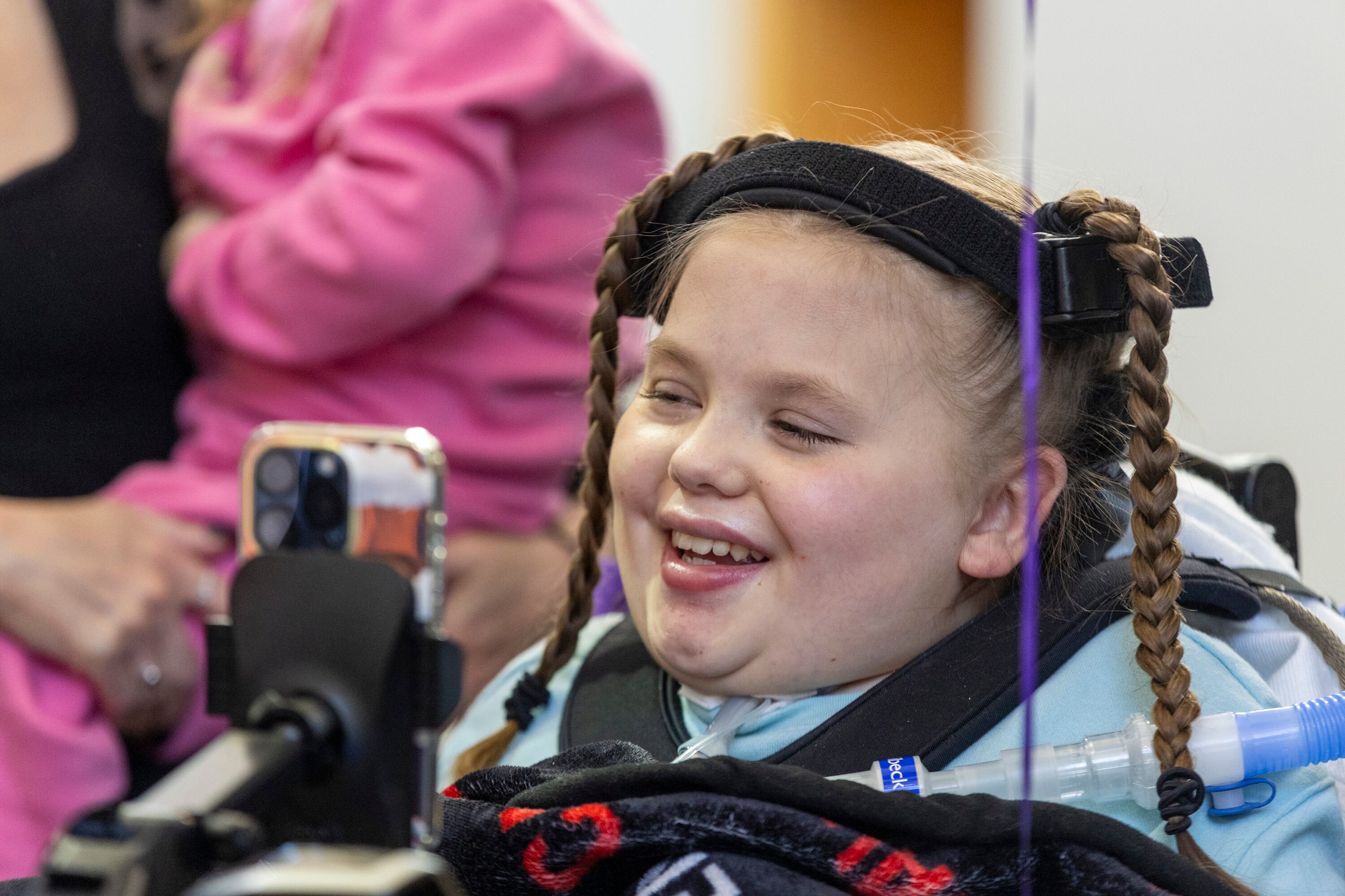 Sophia Ostler laughs with family during a proclamation celebration announcing that her wish has been selected for fulfillment at the Make-A-Wish Utah Headquarters in Murray on Monday.