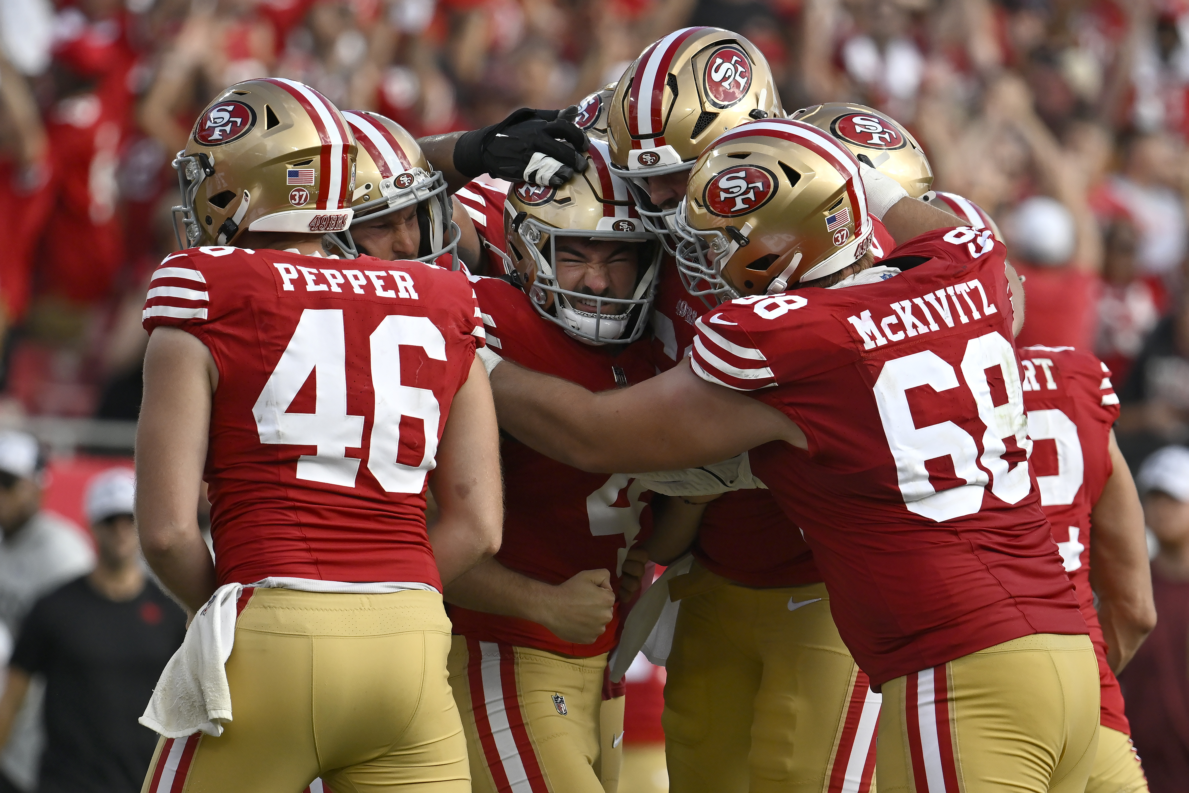 San Francisco 49ers place kicker Jake Moody, middle, celebrates with teammates after kicking the game winning field goal during the second half of an NFL football game against the Tampa Bay Buccaneers in Tampa, Fla., Sunday, Nov. 10, 2024.