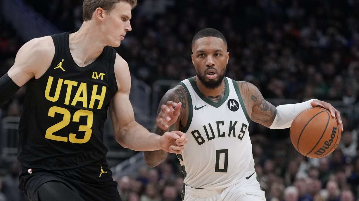 Milwaukee Bucks' Damian Lillard tries to get past Utah Jazz's Lauri Markkanen during the first half of an NBA basketball game Thursday, Nov. 7, 2024, in Milwaukee.