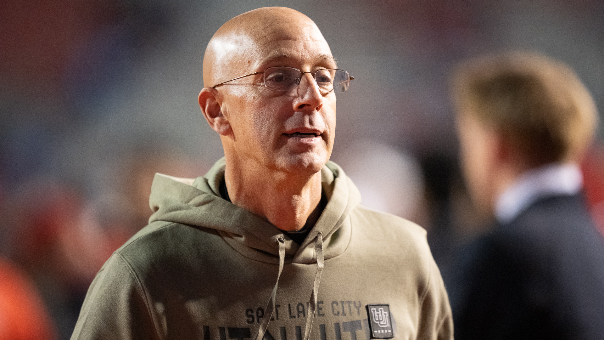 Utes interim offensive coordinator Mike Bajakian walks the sidelines ahead of Utah's rivalry meeting with BYU at Rice-Eccles Stadium on Nov. 9, 2024.