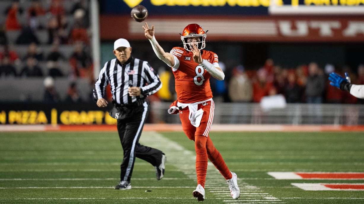 Utah quarterback Brandon Rose throws a pass during a game against rival BYU at Rice-Eccles Stadium on Nov. 9, 2024.