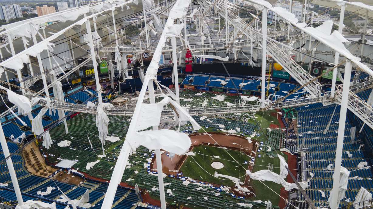 FILE - The roof of the Tropicana Field is damaged the morning after Hurricane Milton hit the region, Oct. 10, 2024, in St. Petersburg, Fla.