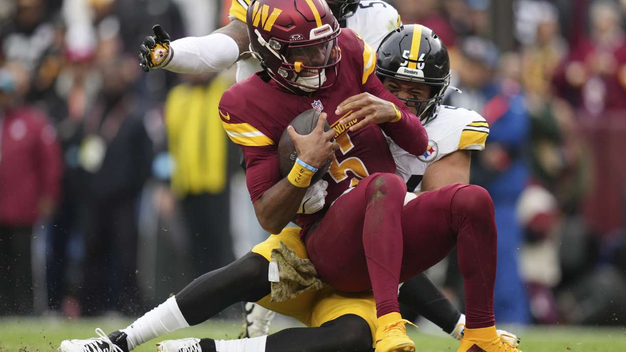 Pittsburgh Steelers linebacker Alex Highsmith (56) sacks Washington Commanders quarterback Jayden Daniels (5) during the first half of an NFL football game, Sunday, Nov. 10, 2024, in Landover, Md.