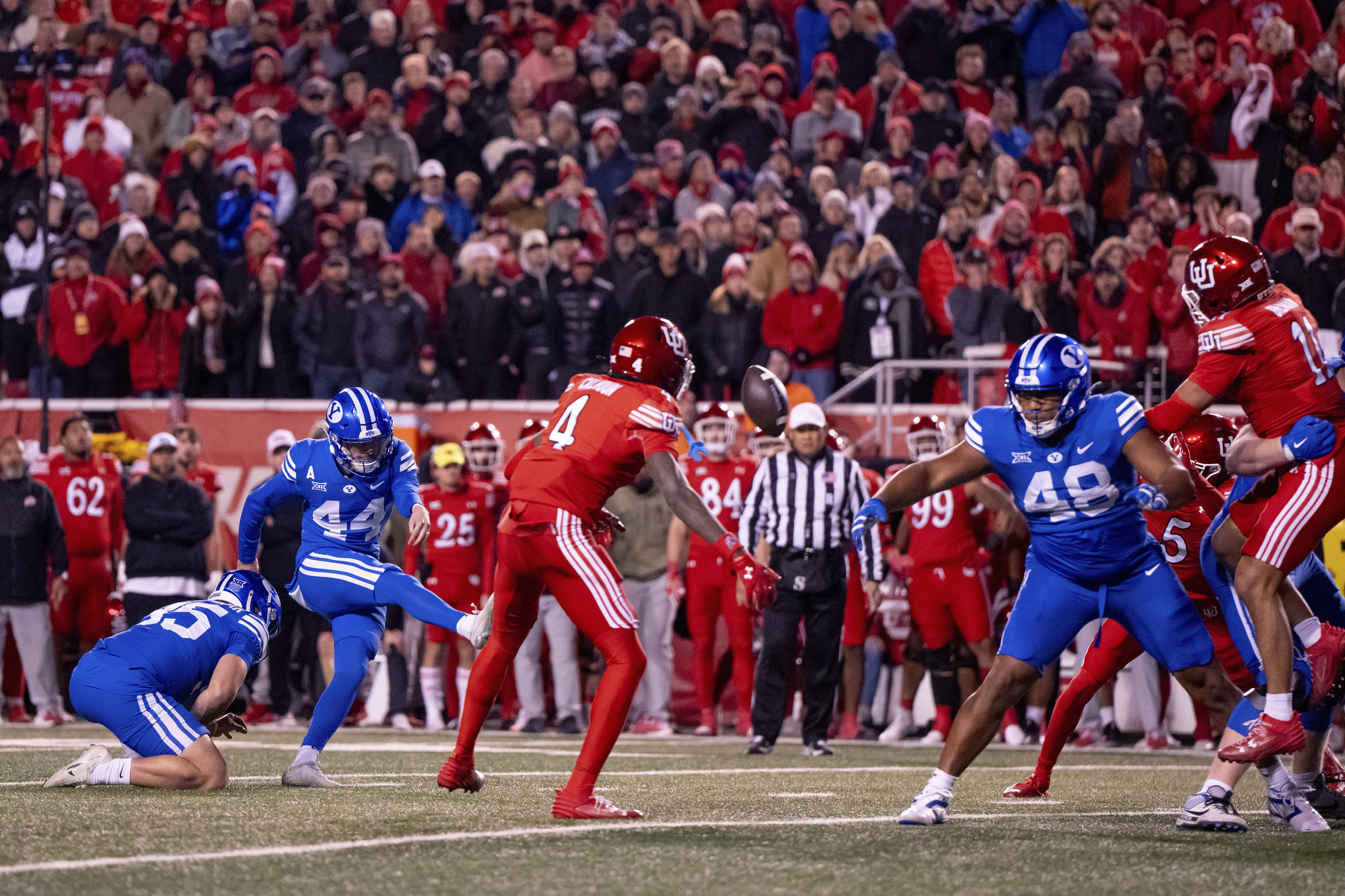 BYU place kicker Will Ferrin (44) kicks a game-winning field goal in the second half of an NCAA college football game against Utah, just after midnight on Sunday, Nov. 10, 2024, in Salt Lake City.