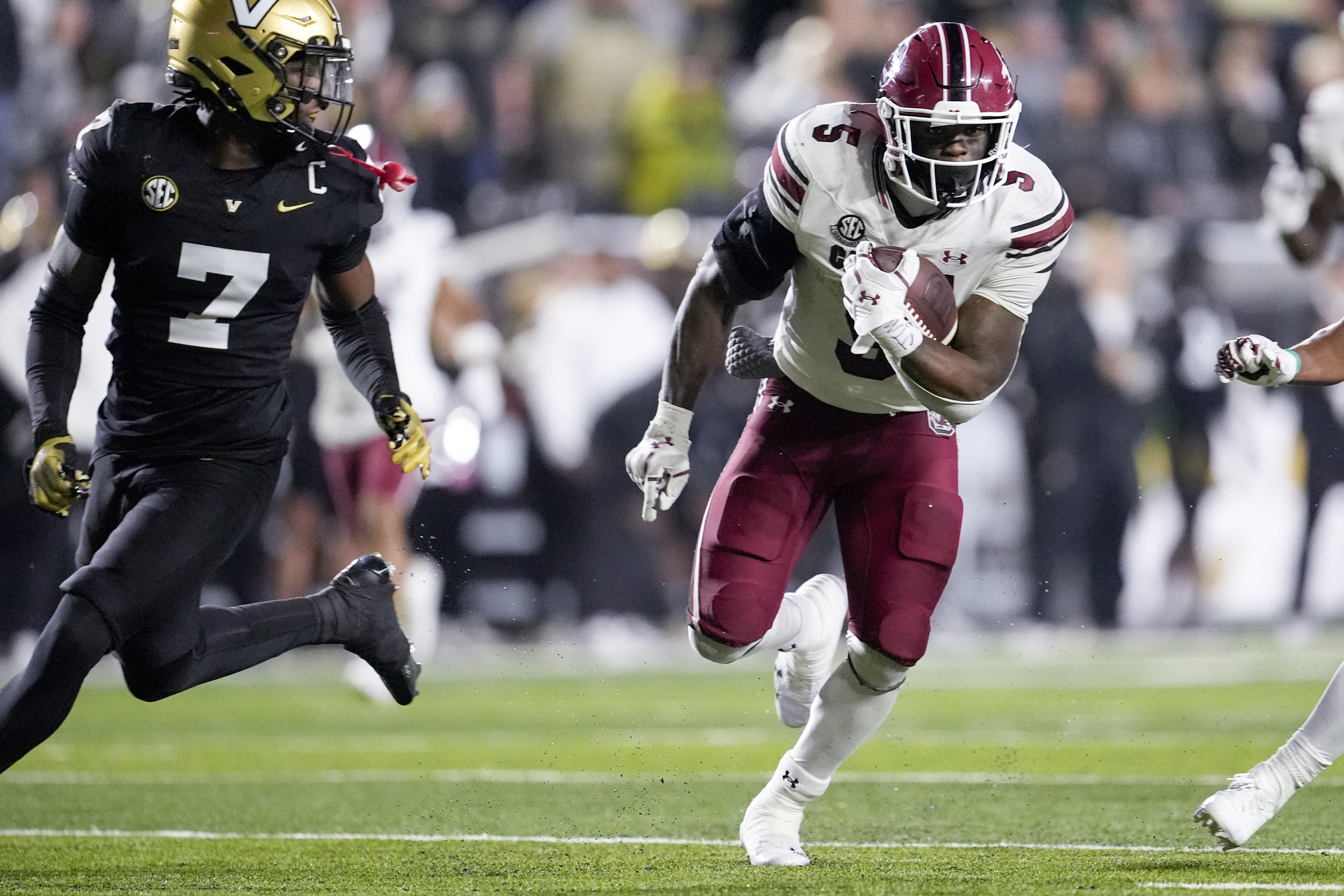 South Carolina running back Raheim Sanders (5) runs the ball past Vanderbilt safety Marlen Sewell (7) during the second half of an NCAA college football game Saturday, Nov. 9, 2024, in Nashville, Tenn.