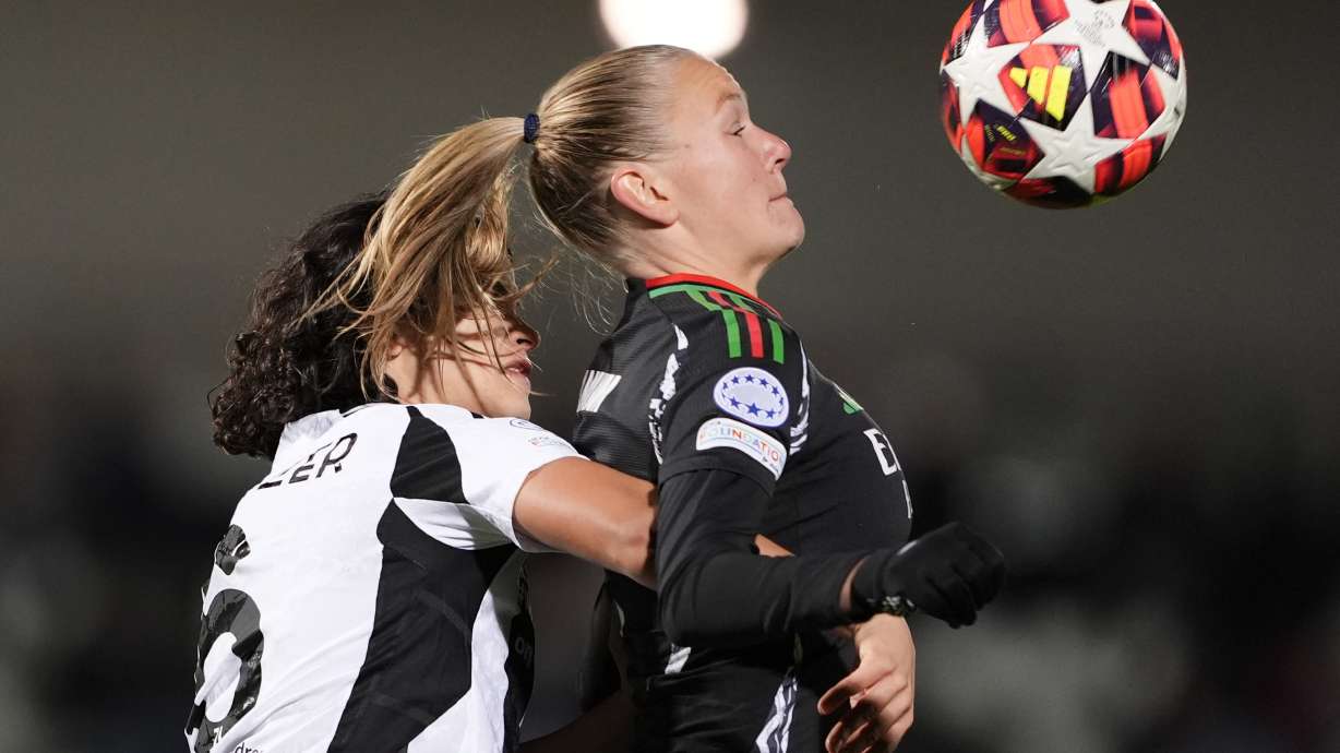 Arsenal's Frida Leonhardsen Maanum, right, and Juventus' Eva Schatzer vie for the ball during the women's Champions League soccer match between Juventus and Arsenal at the Vittorio Pozzo La Marmora Stadium in Biella, Italy, Tuesday, Nov. 12, 2024.