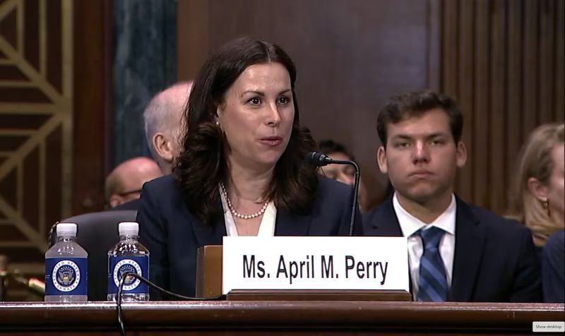 April Perry, a nominee to serve as a federal judge in the Northern District of Illinois, appears before the Senate Judiciary Committee in Washington, July 31.