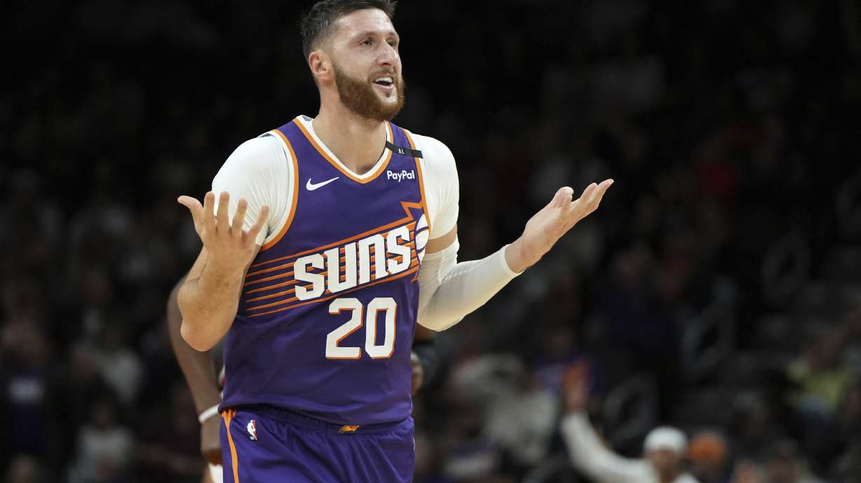 Phoenix Suns center Jusuf Nurkic reacts after scoring against the Miami Heat during the first half of an NBA basketball game, Wednesday, Nov. 6, 2024, in Phoenix.