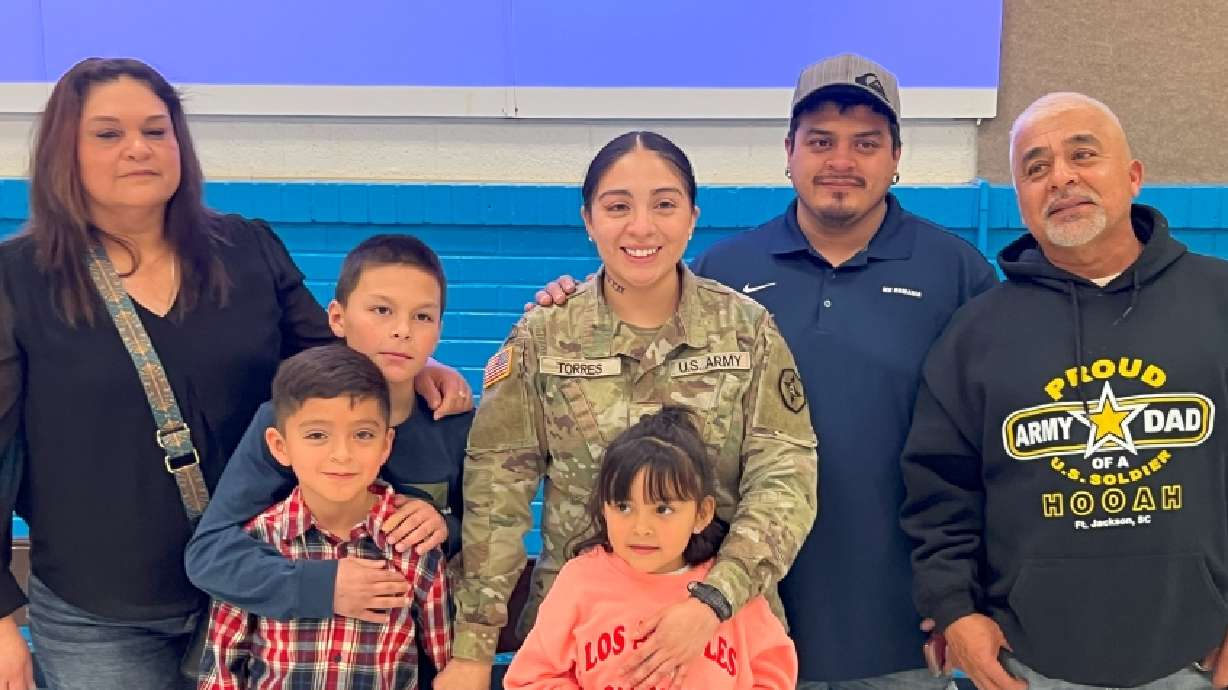 Specialist Isabelle Torres is greeted by her mom Vicky, son Raiden, nephew Isaac, daughter Nylah, brother Javier and father Cosme Torres at Temple View Elementary in a Veteran’s Day surprise.