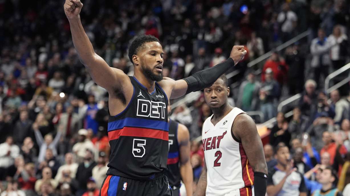 Detroit Pistons guard Malik Beasley (5) raises his arms after making freethrows to win the game against the Miami Heat during overtime of an Emirates NBA Cup basketball game, Tuesday, Nov. 12, 2024, in Detroit.