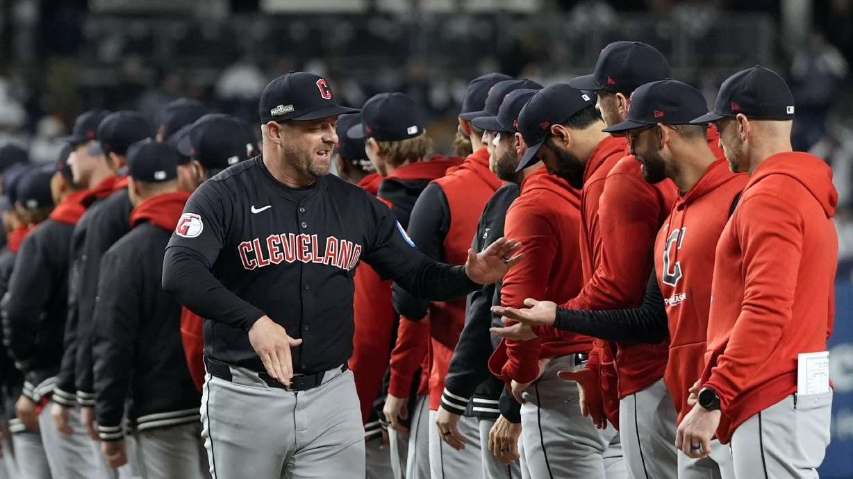 Cleveland Guardians manager Stephen Vogt greets players before Game 1 of the baseball AL Championship Series against the New York Yankees Monday, Oct. 14, 2024, in New York.