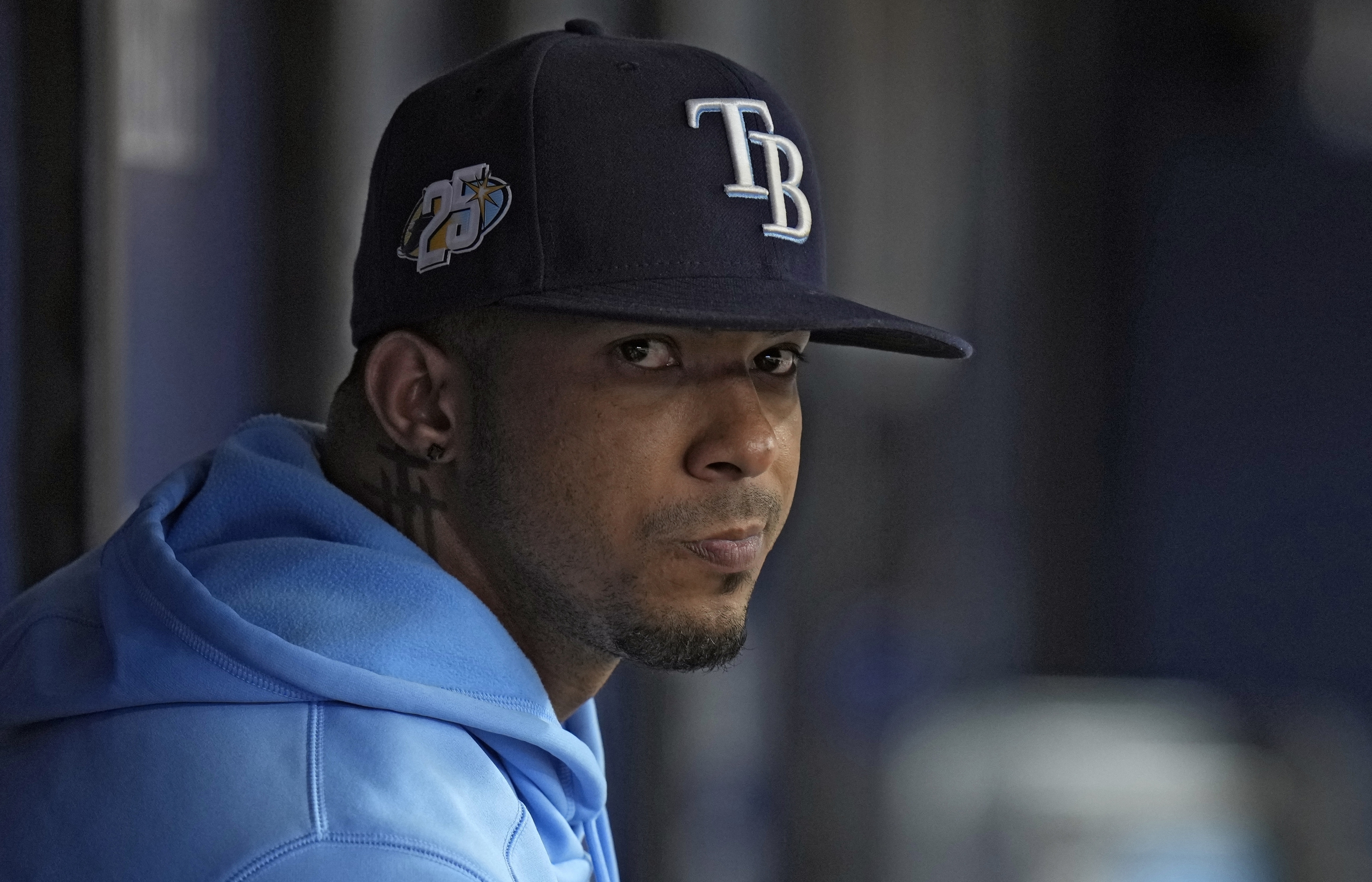FILE - Tampa Bay Rays shortstop Wander Franco watches from the dugout during the fifth inning of a baseball game against the Cleveland Guardians, Aug. 13, 2023, in St. Petersburg, Fla.