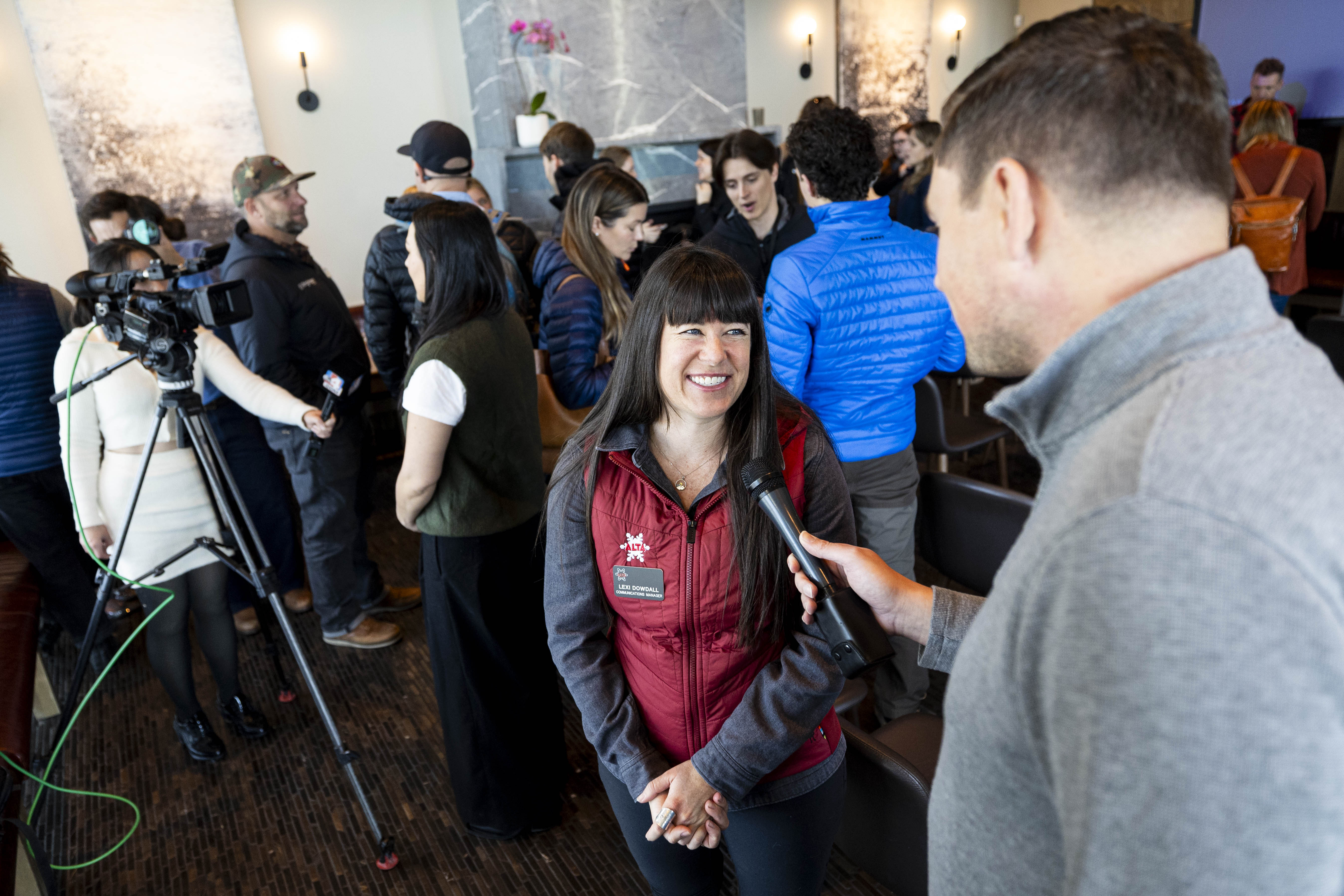 Lexi Dowdall, communications manager at Alta, is interviewed by a member of the media after a press conference held by Ski Utah and their resort partners at Urban Hill in Salt Lake City on Wednesday.