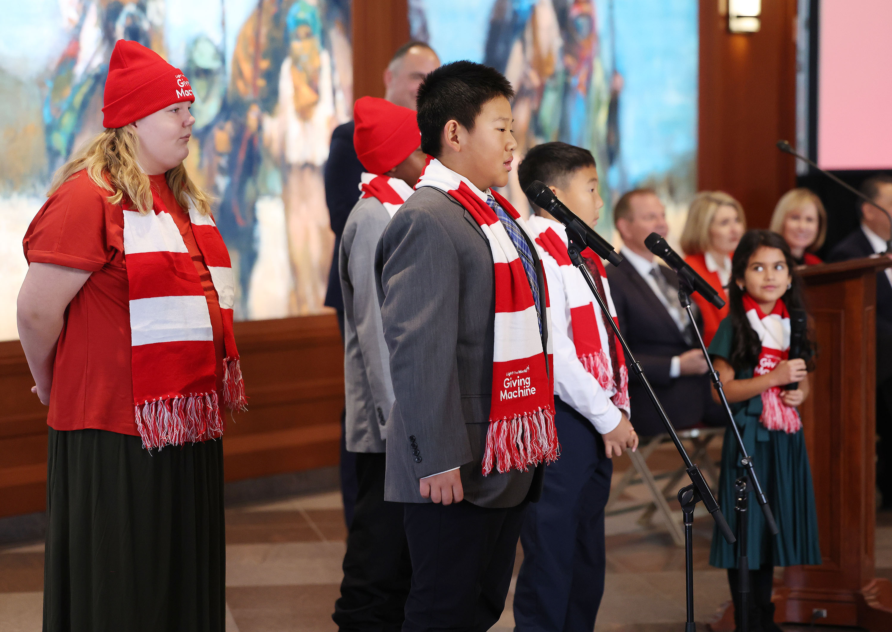 New cities are announced during the global launch of the Light the World Giving Machines at the Conference Center in Salt Lake City on Wednesday.