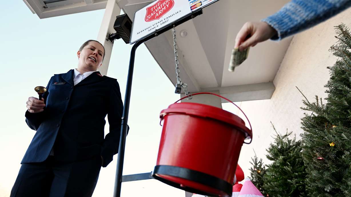 Salvation Army Lt. Kate Combs rings a bell as she collects money donations and greets shoppers at Smith's in Bountiful on Dec. 5, 2023. Utah is among the most charitable states, a report finds.