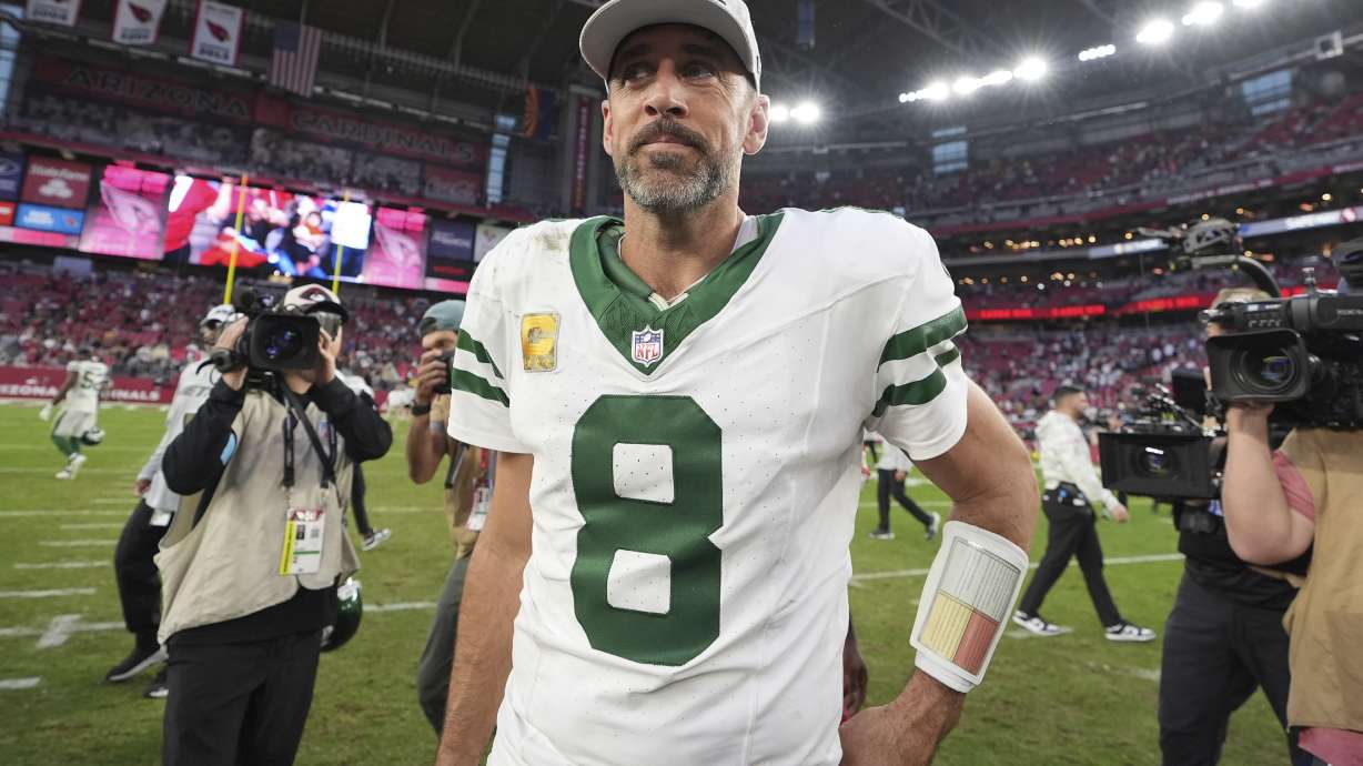 New York Jets quarterback Aaron Rodgers leaves the field after an NFL football game against the Arizona Cardinals, Sunday, Nov. 10, 2024, in Glendale, Ariz.