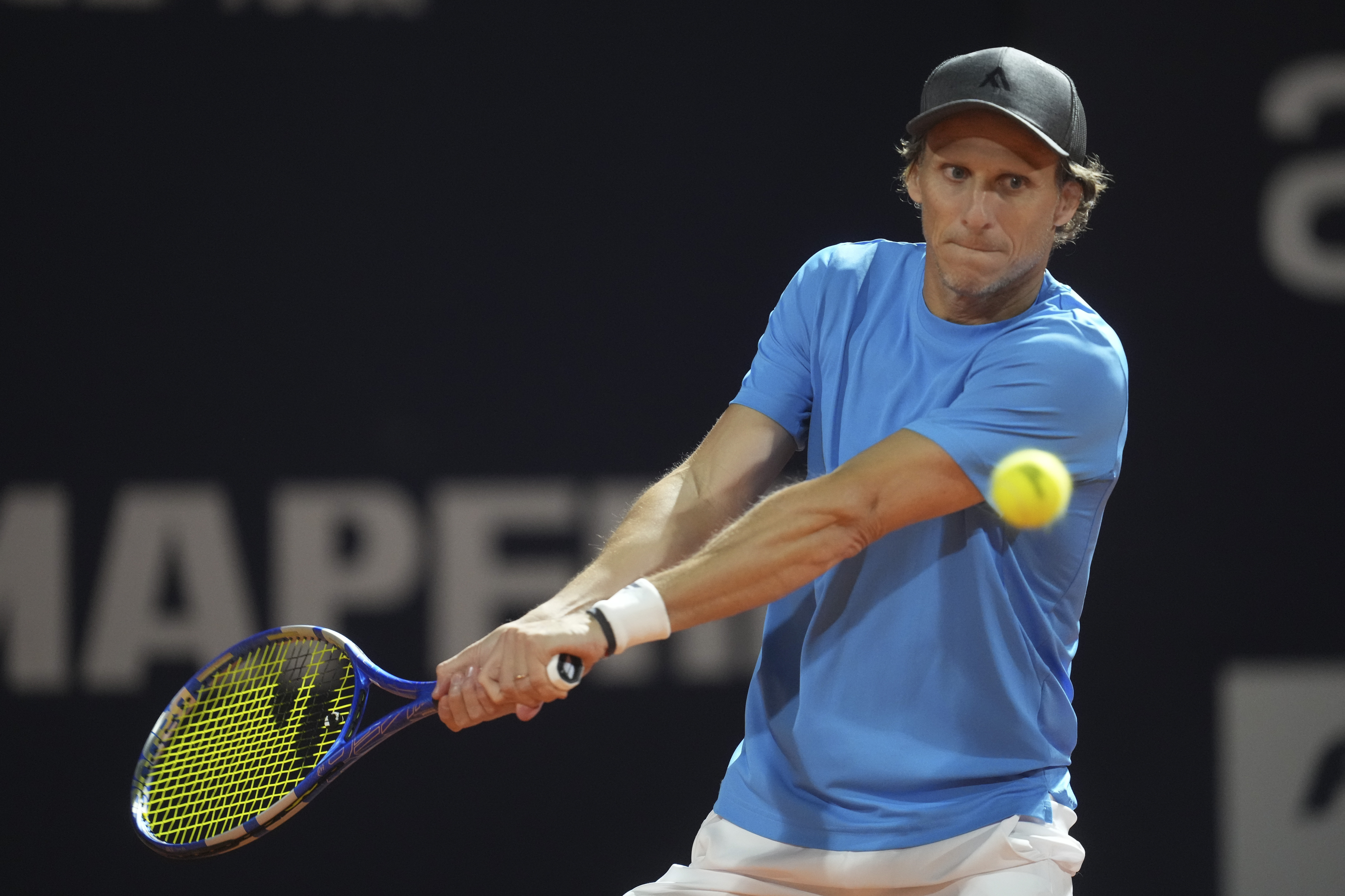 Uruguay's Diego Forlan returns the ball to Boris Arias and Federico Zeballos during a men's doubles tennis match at the 2024 Uruguay Open in Montevideo, Uruguay, Wednesday, Nov. 13, 2024. 
