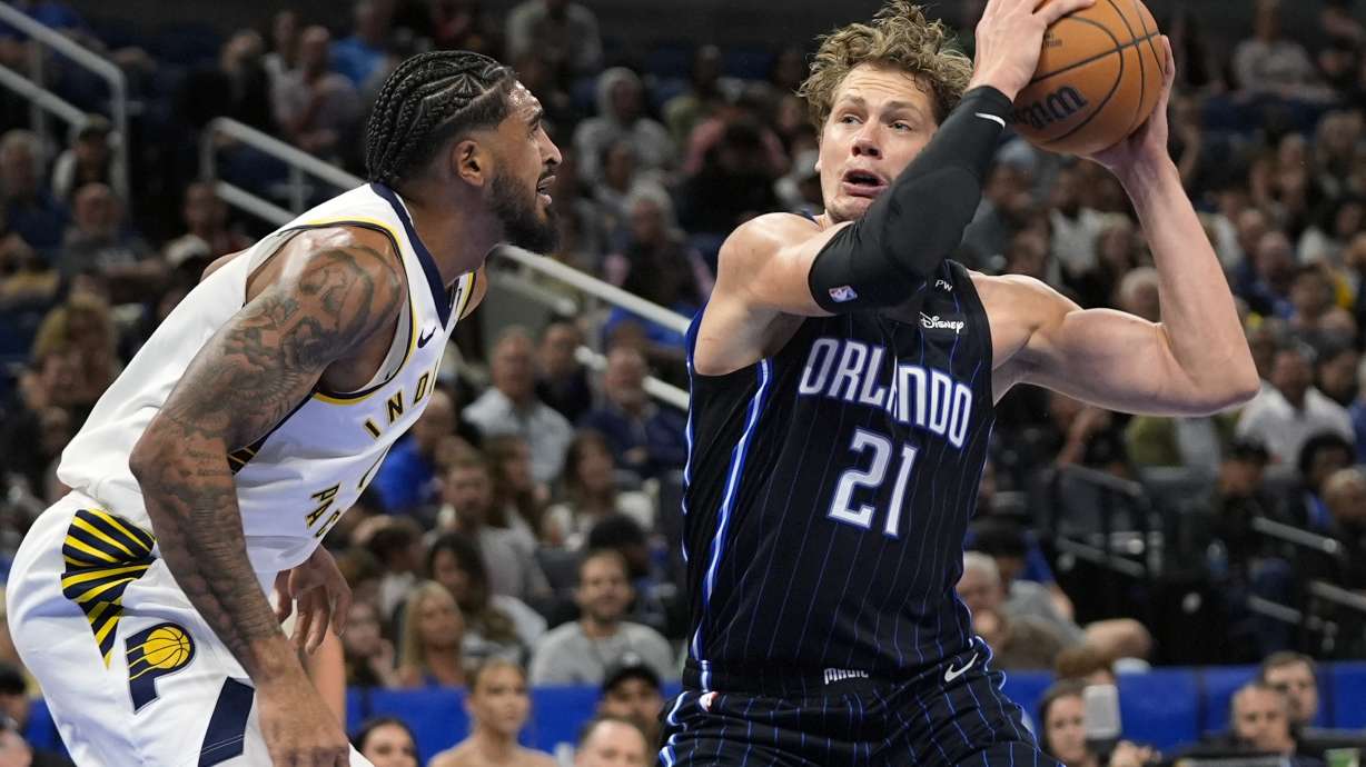 Orlando Magic center Moritz Wagner (21) looks for a shot against Indiana Pacers forward Obi Toppin, left, during the first half of an NBA basketball game, Wednesday, Nov. 13, 2024, in Orlando, Fla.