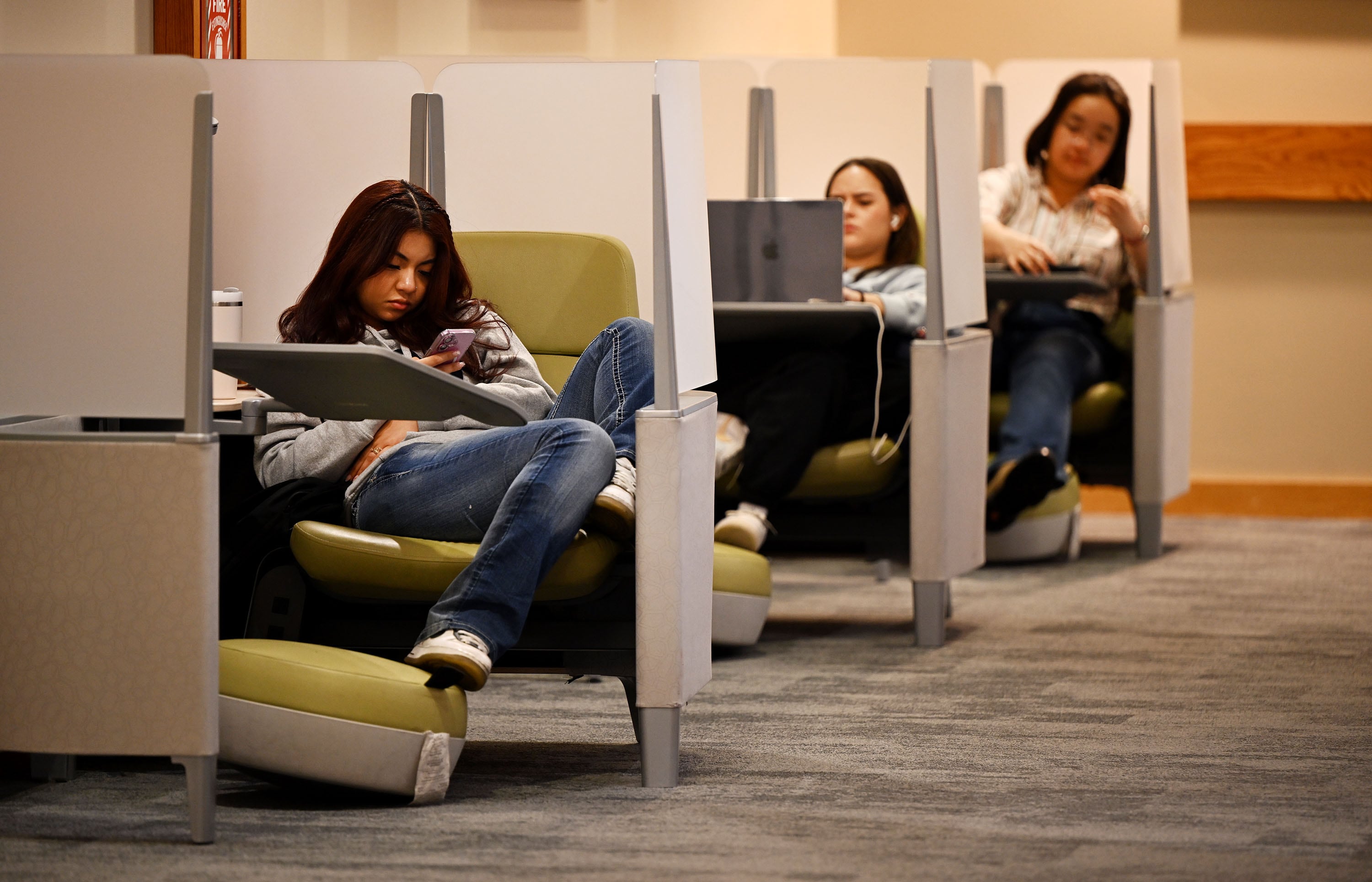 Students sit in small cubicles at Salt Lake Community College in Taylorsville on Tuesday.