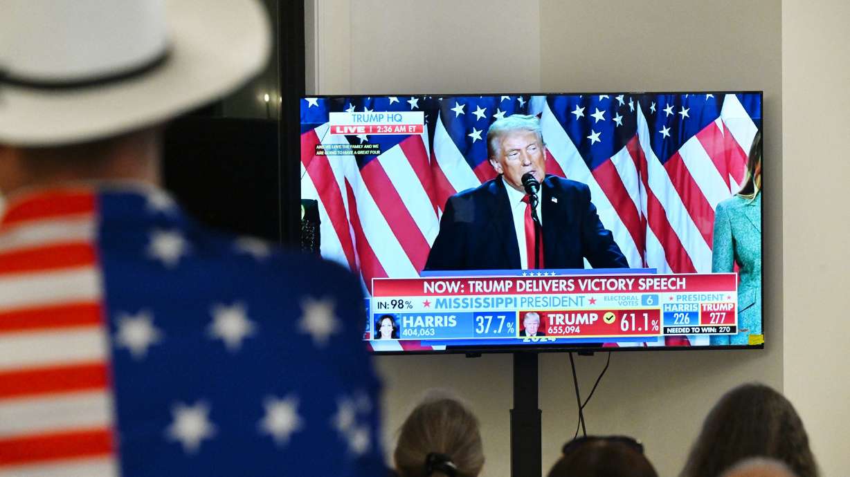 Utah GOP supporters watch as President-elect Donald J. Trump delivers his victory speech on TV as they gather in Draper for an election party on Nov. 6.
