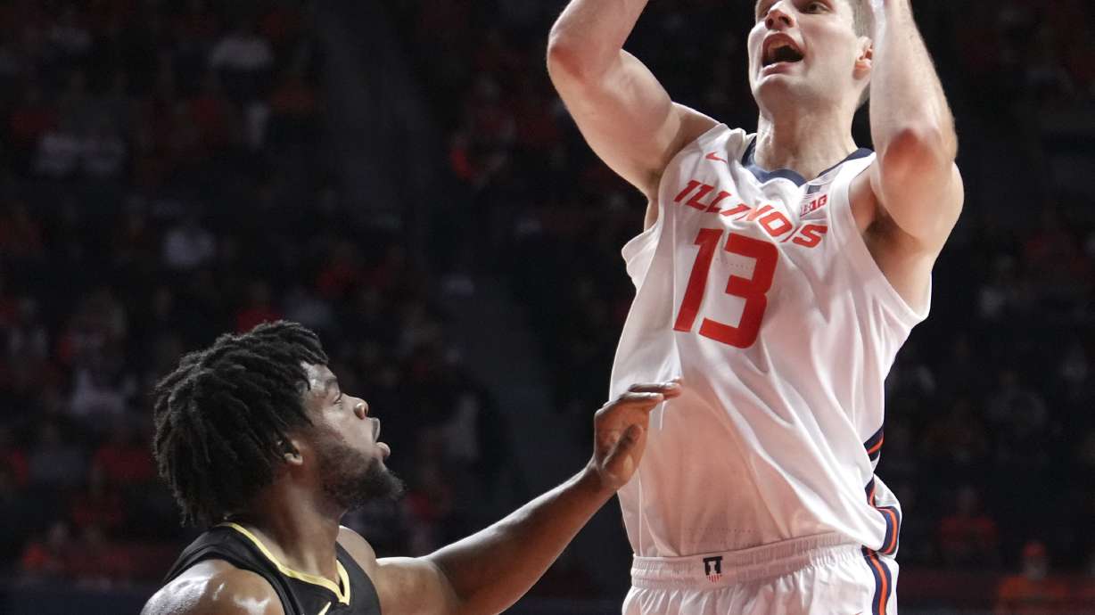 Illinois's Tomislav Ivisic (13) shoots over Oakland's Allen Mukeba during the first half of an NCAA college basketball game Wednesday, Nov. 13, 2024, in Champaign, Ill.