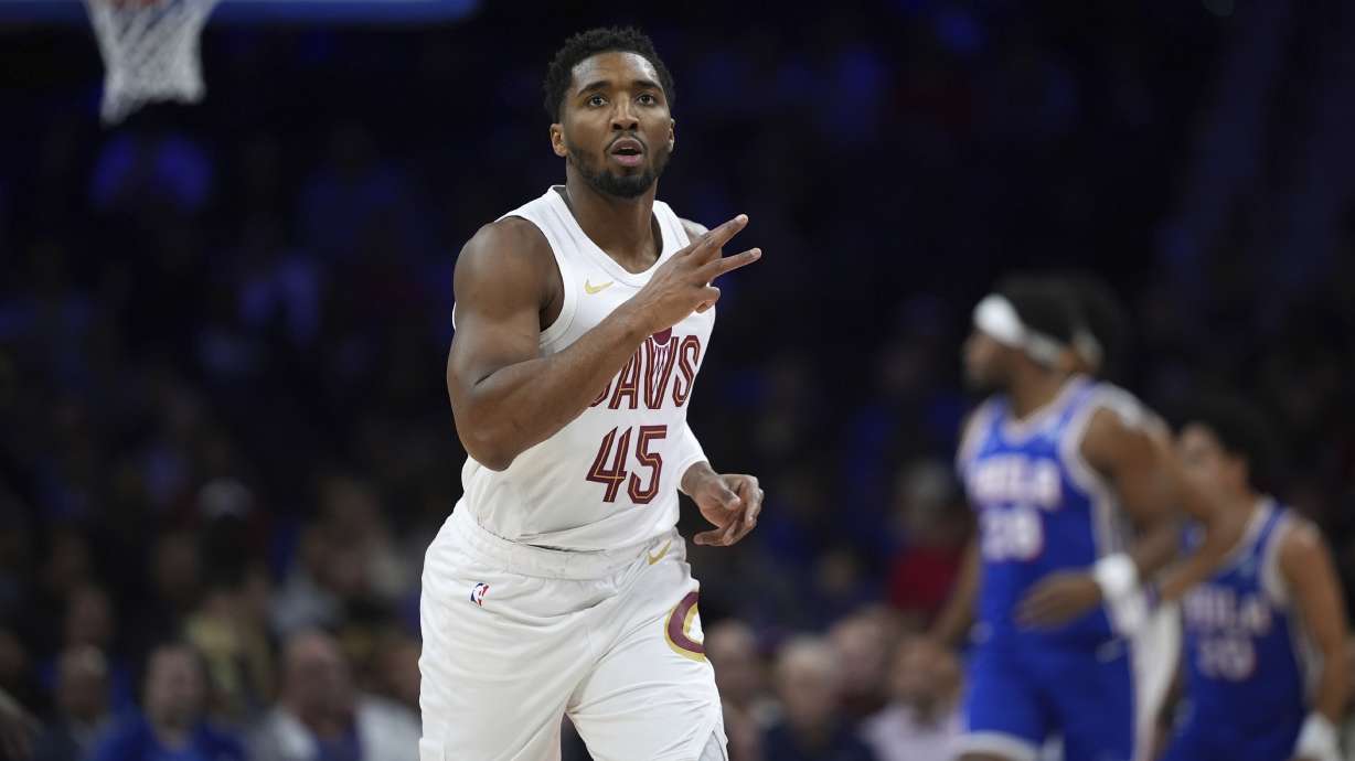 Cleveland Cavaliers' Donovan Mitchell reacts after scoring during the first half of an NBA basketball game against the Philadelphia 76ers, Wednesday, Nov. 13, 2024, in Philadelphia.