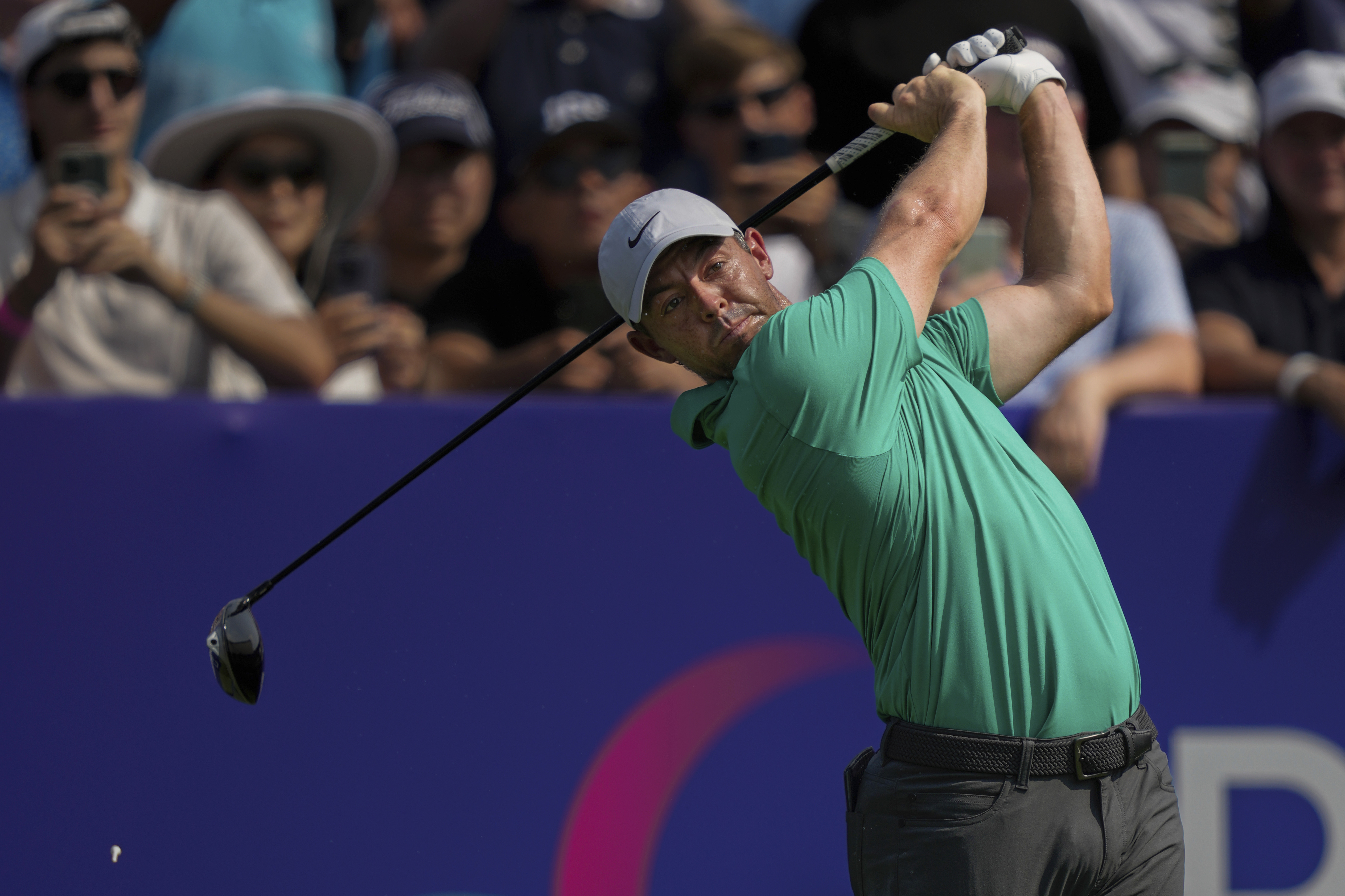 Rory McIlroy of Northern Ireland hits off the first tee during the first round of World Tour Golf Championship in Dubai, United Arab Emirates, Thursday, Nov. 14, 2024.