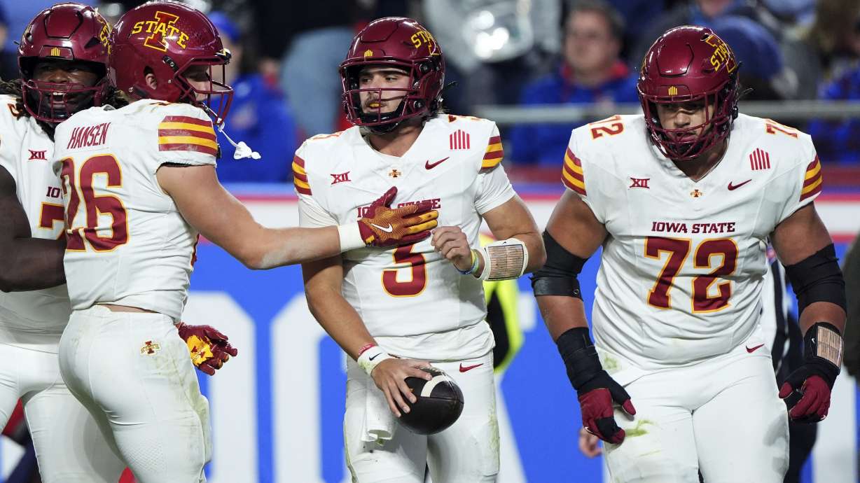 Iowa State quarterback Rocco Becht (3) celebrates with teammates after running for a two-point conversion during the second half of an NCAA college football game against Kansas Saturday, Nov. 9, 2024, in Kansas City, Mo. Kansas won 45-36.