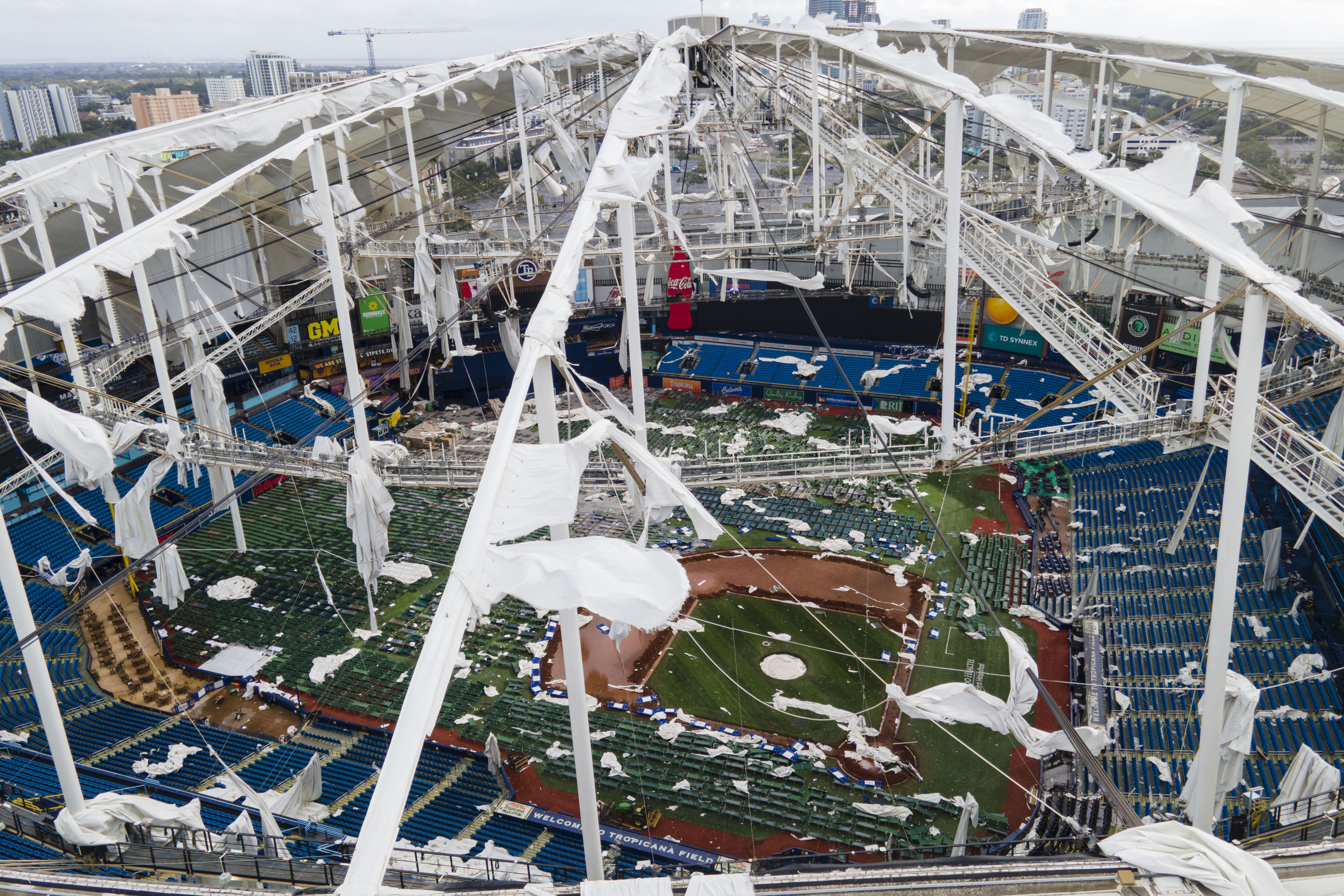 FILE - The roof of the Tropicana Field is damaged the morning after Hurricane Milton hit the region, Oct. 10, 2024, in St. Petersburg, Fla.
