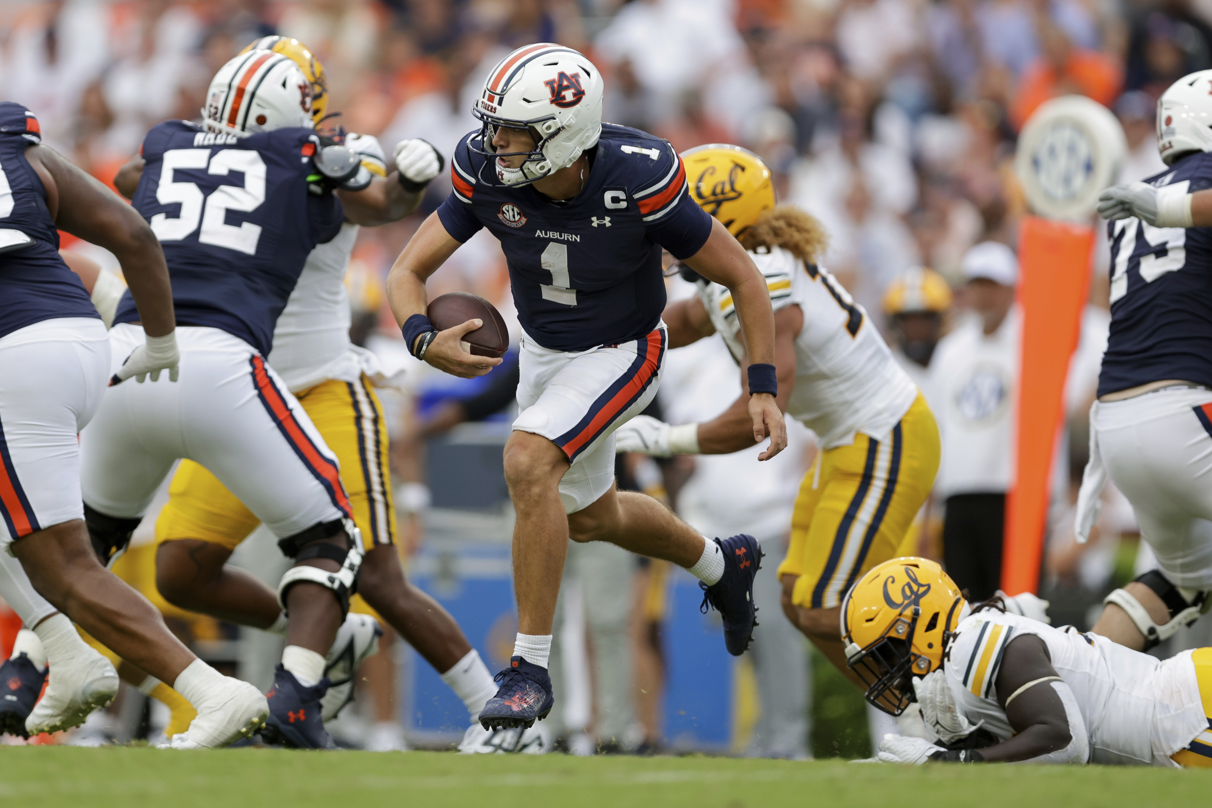 FILE - Auburn's Payton Thorne (1) runs the ball during the second half of an NCAA football game against California, Sept. 7, 2024 in Auburn, Ala.