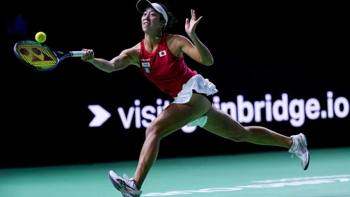 Japan's Ena Shibahara returns the ball against Romania's Jaqueline Cristian during the Billie Jean King Cup Finals, at the Martin Carpena Sports Hall, in Malaga, southern Spain, on Thursday, Nov. 14, 2024.