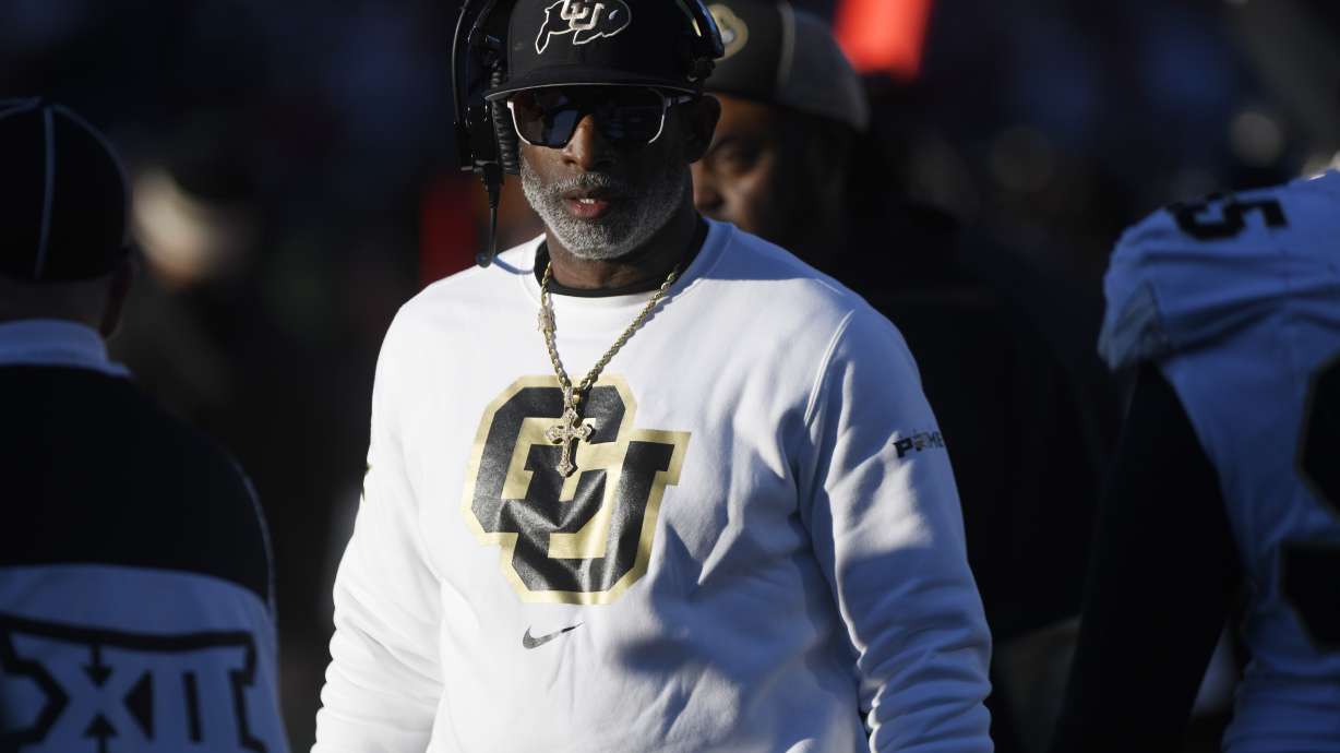 Colorado's head coach Deion Sanders walks along the sidelines during the second half of an NCAA college football game against Texas Tech, Saturday, Nov. 9, 2024, in Lubbock, Texas.